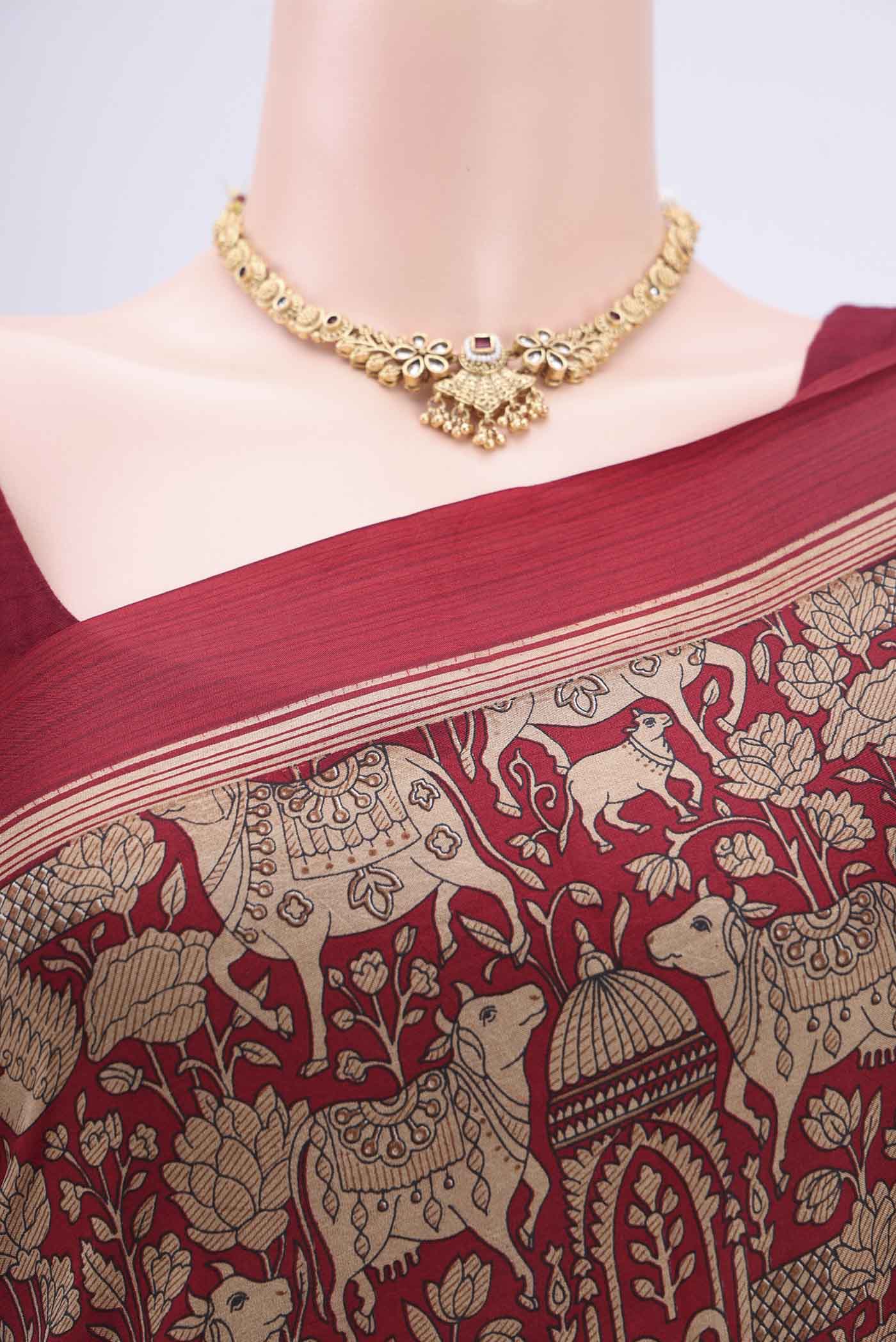 Border image of Maroon Printed Silk Saree with Printed design on the body and Plain Border. 