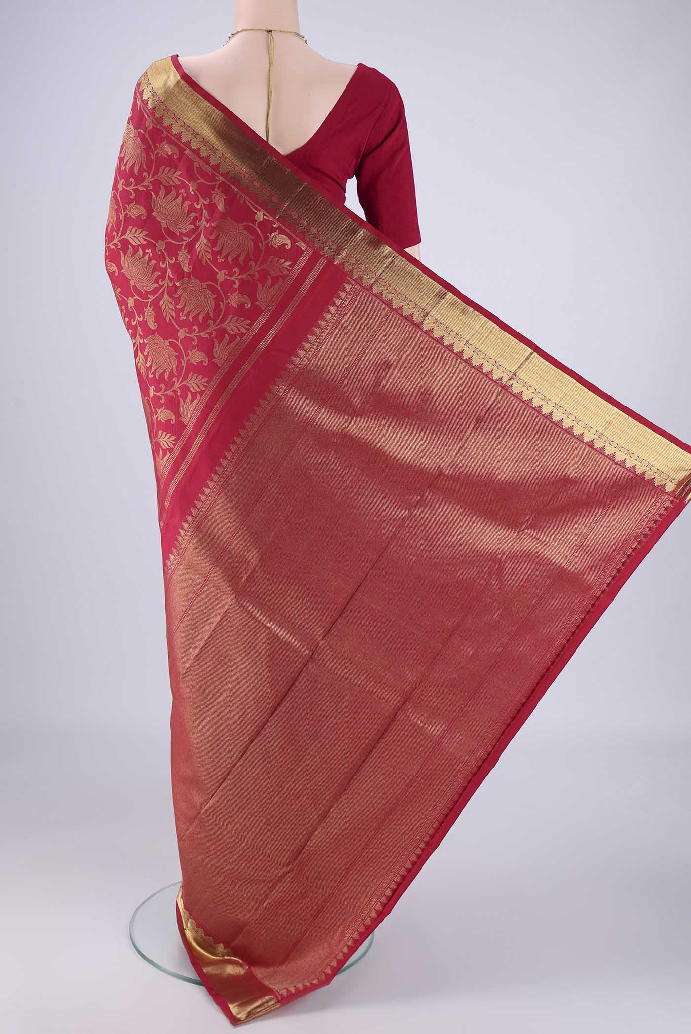 Flat view of Maroon Kanjivaram Silk Saree with Zari Brocade on the body and Zari Border. 