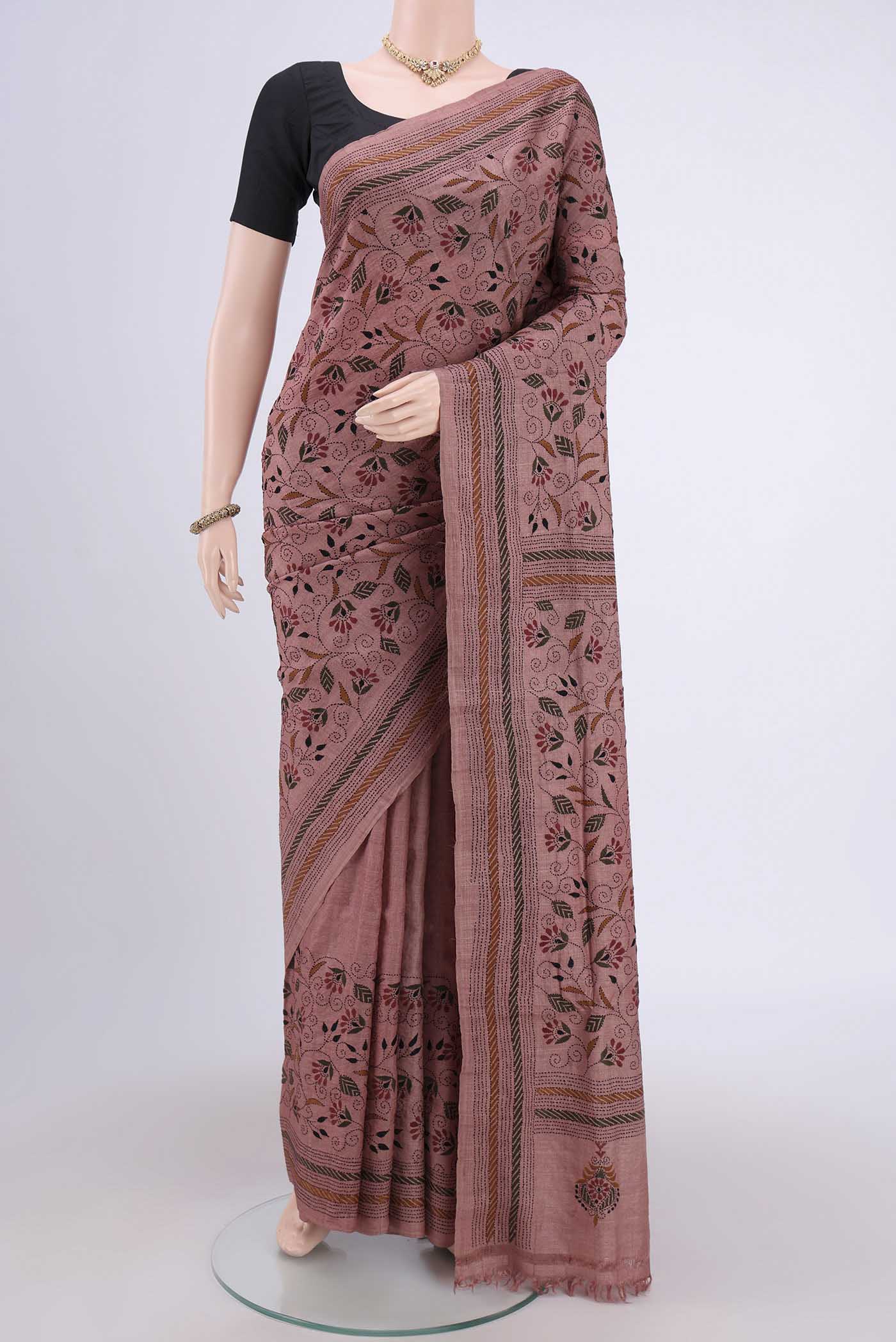 Coral Kantha Silk Saree with Kantha Work on the body and Thread Border.  displayed on a mannequin
