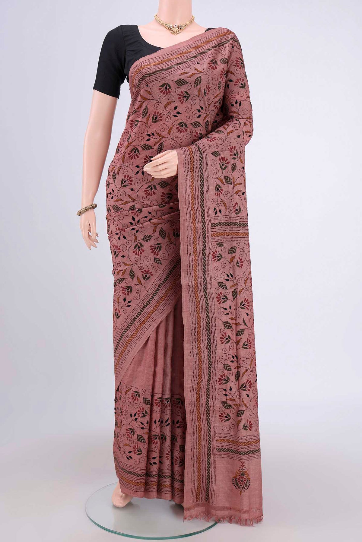 Coral Kantha Silk Saree with Kantha Work on the body and Thread Border.  displayed on a mannequin