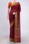 Turquoise Kanchi Cotton Saree with Zari Butta on the body and Zari Border.  displayed on a mannequin