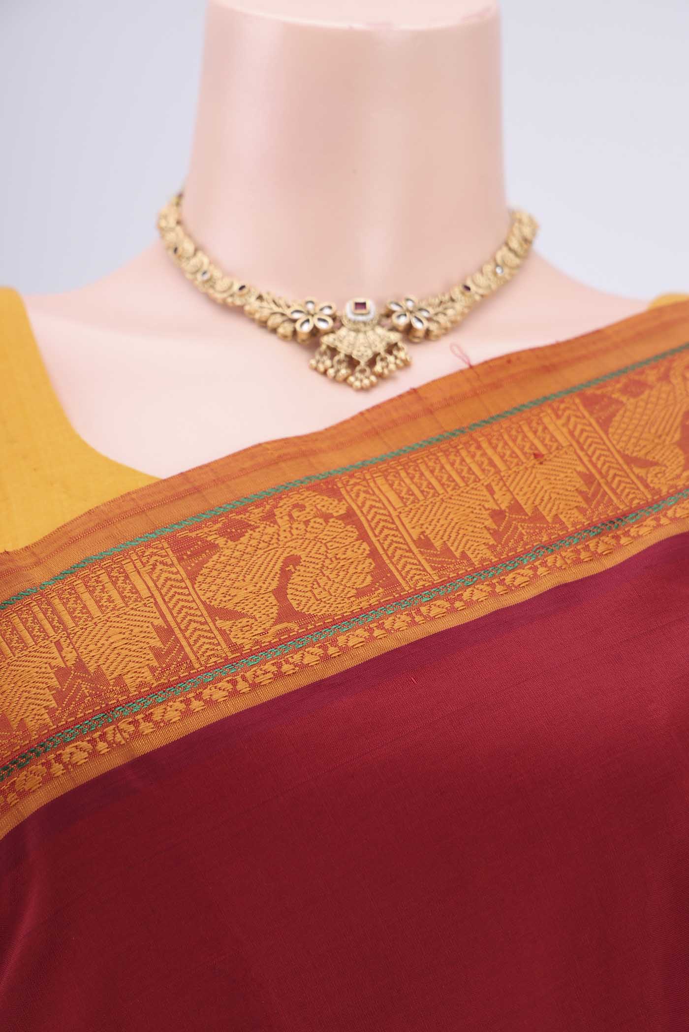 Border image of Maroon Blended Poly Cotton Saree with Plain Body and Thread Border. 