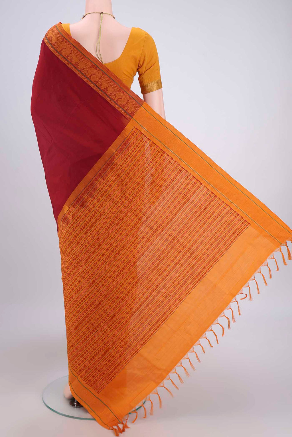 Flat view of Maroon Blended Poly Cotton Saree with Plain Body and Thread Border. 