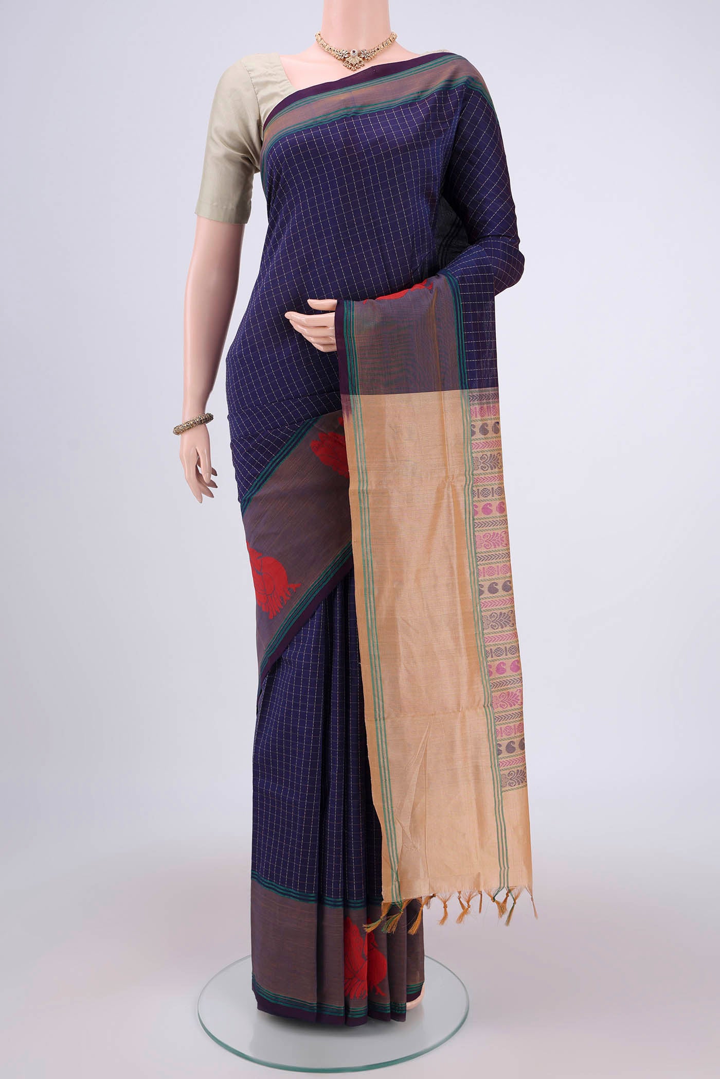 Burgundy Blended Poly Cotton Saree with Checked design on the body and Thread Border.  displayed on a mannequin