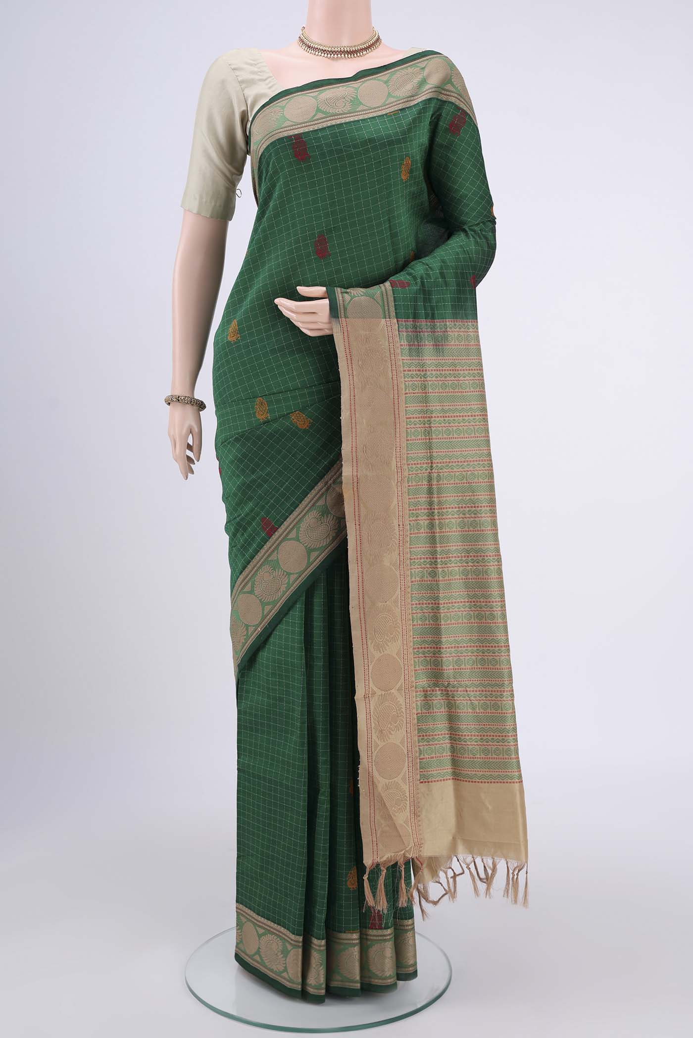 Bottle Green Blended Poly Cotton Saree with Checked design on the body and Thread Border.  displayed on a mannequin