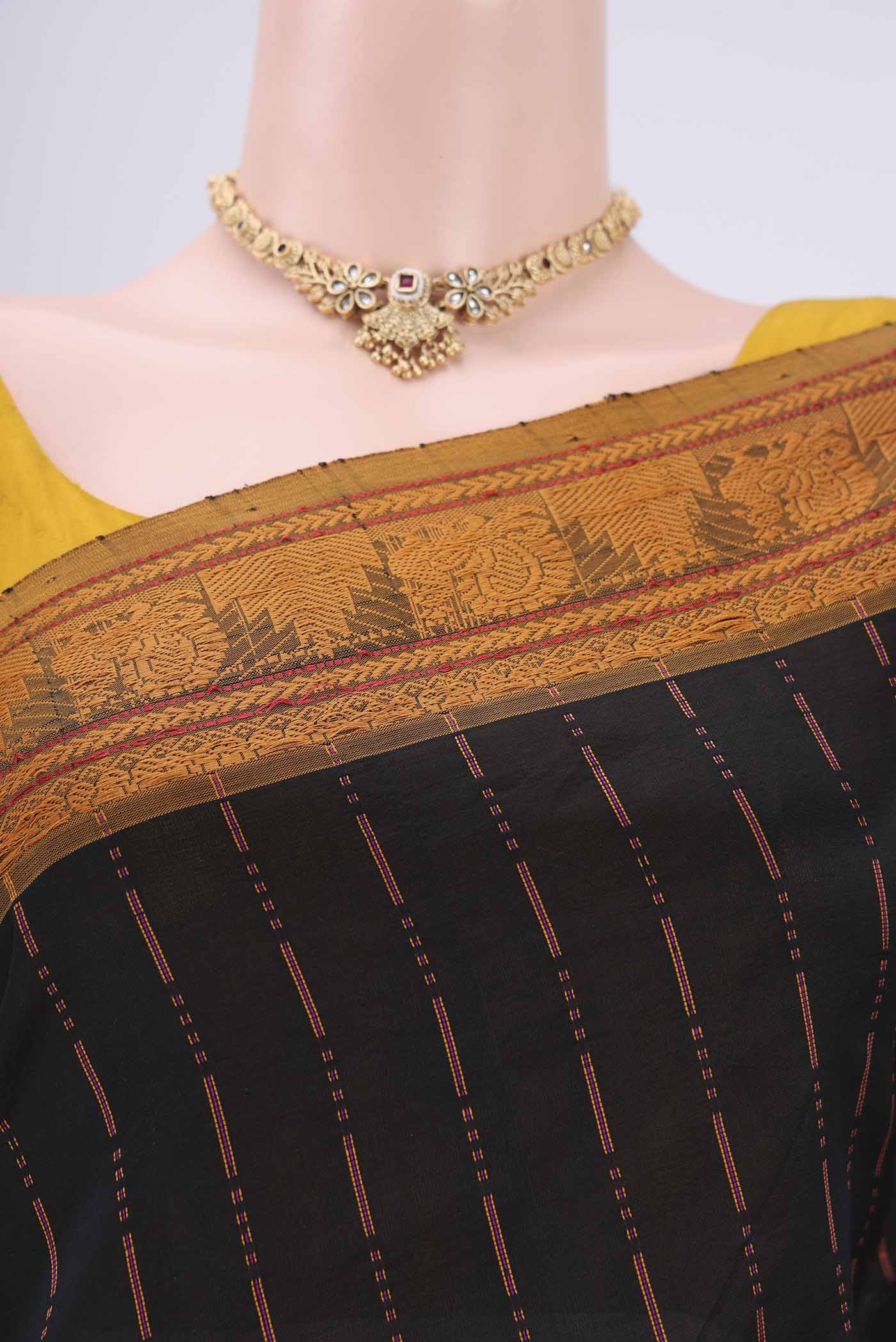 Border image of Black Blended Poly Cotton Saree with Stripes on the body and Thread Border. 