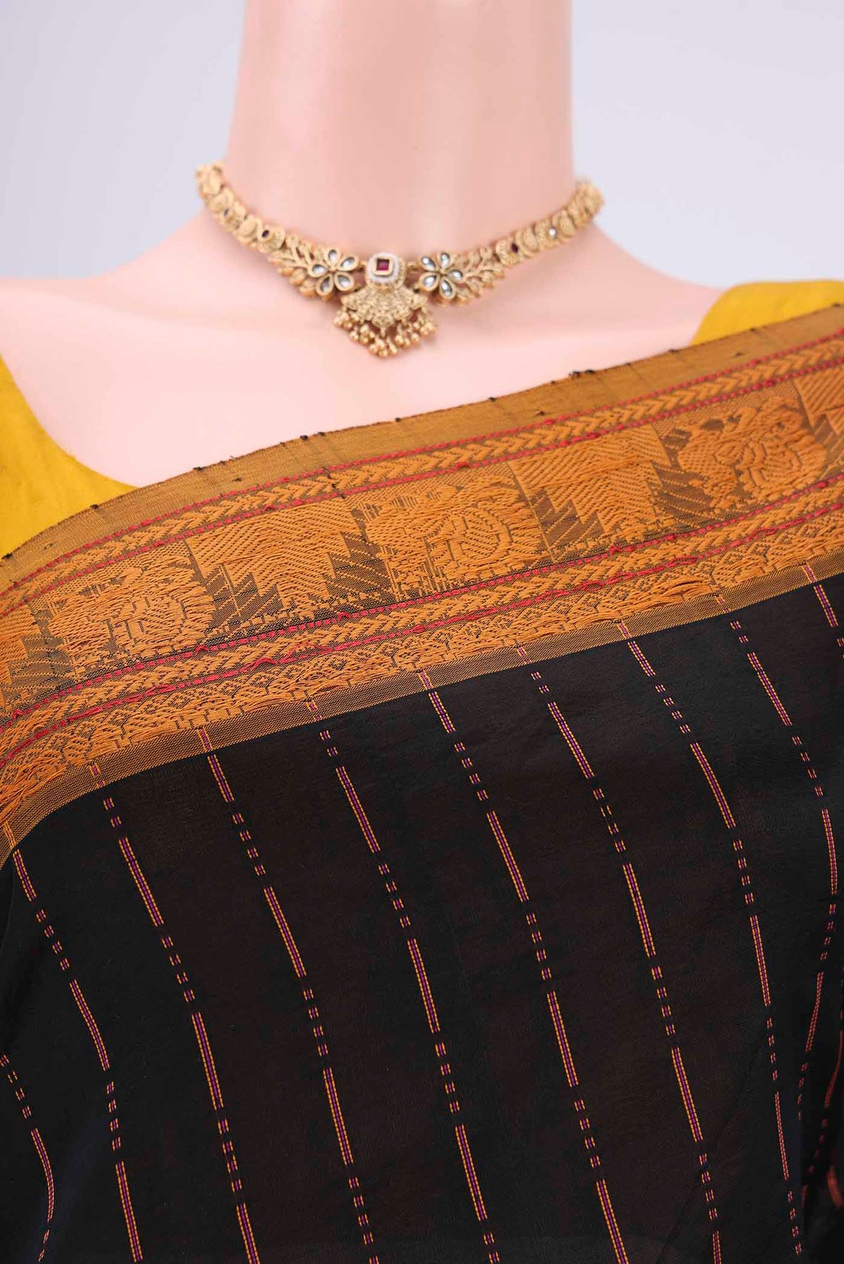 Border image of Black Blended Poly Cotton Saree with Stripes on the body and Thread Border. 