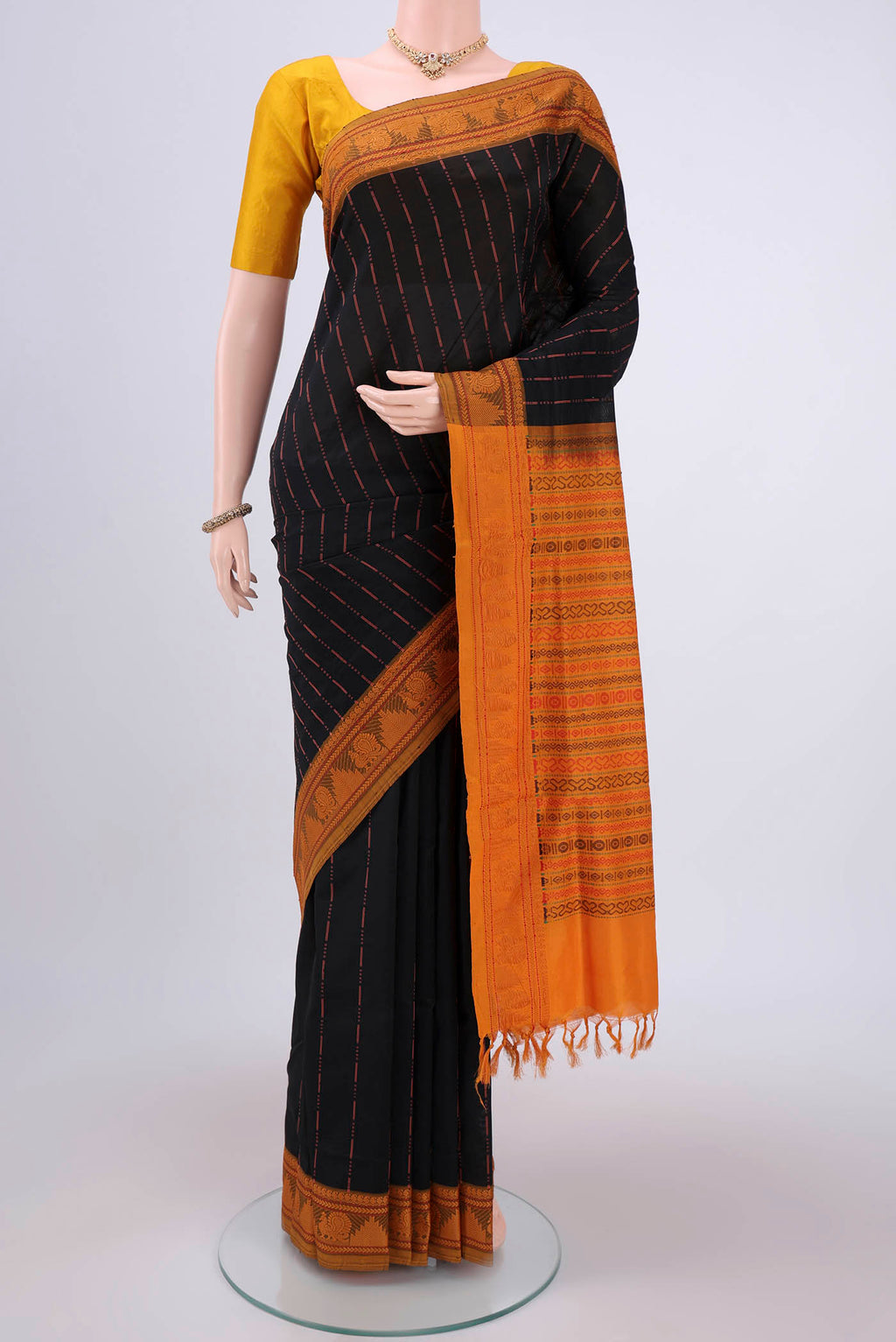 Black Blended Poly Cotton Saree with Stripes on the body and Thread Border.  displayed on a mannequin