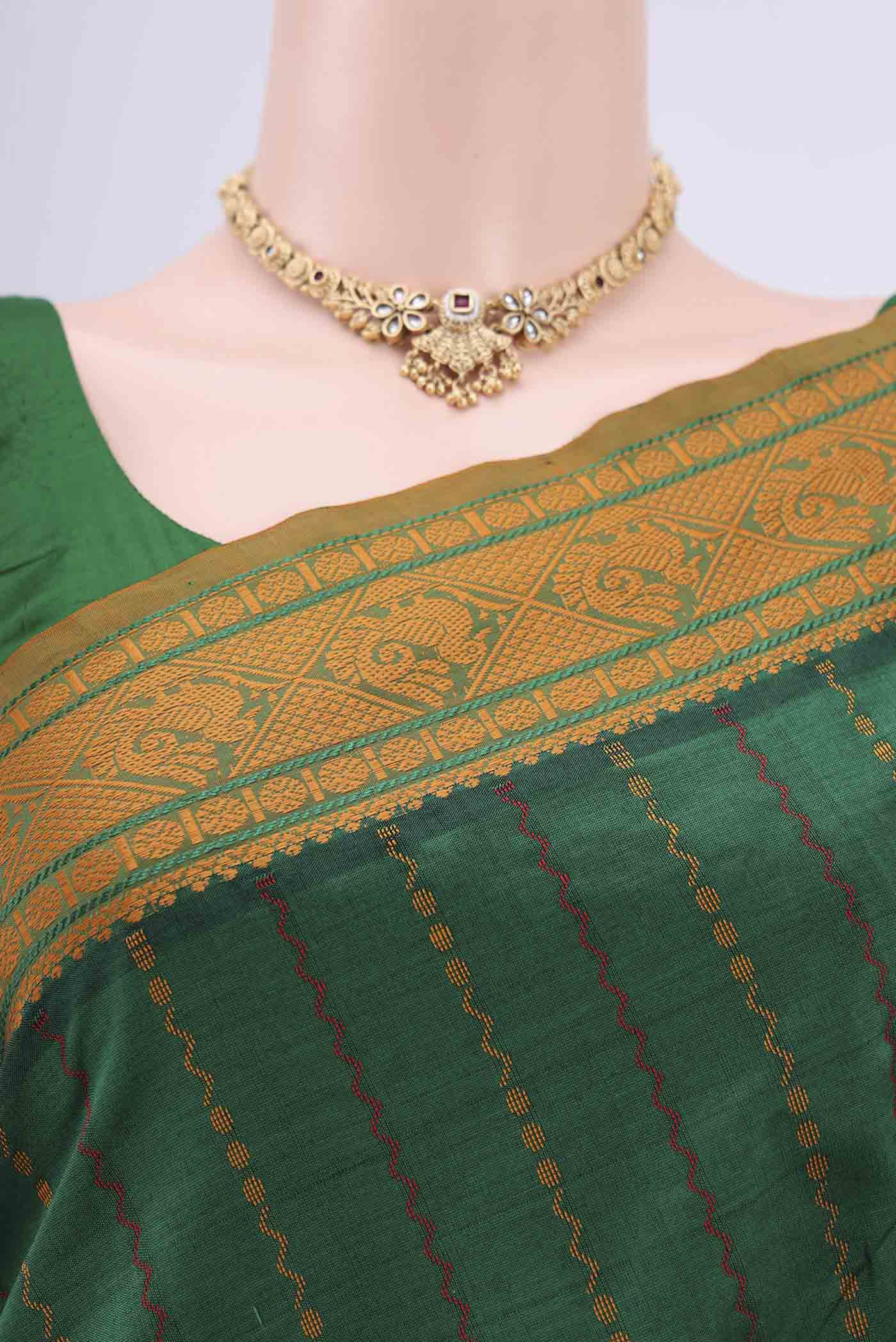 Border image of Green Blended Silk Cotton Saree with Stripes on the body and Thread Border. 