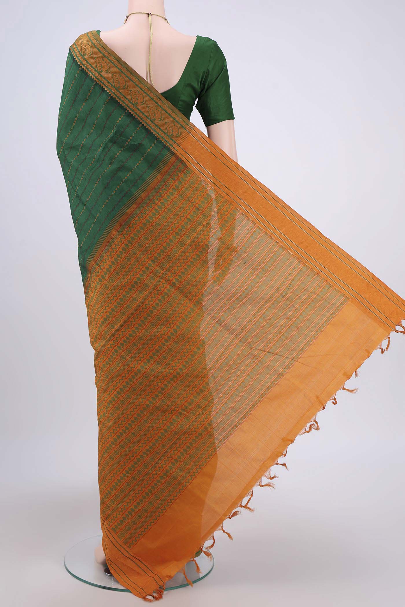 Flat view of Green Blended Silk Cotton Saree with Stripes on the body and Thread Border. 