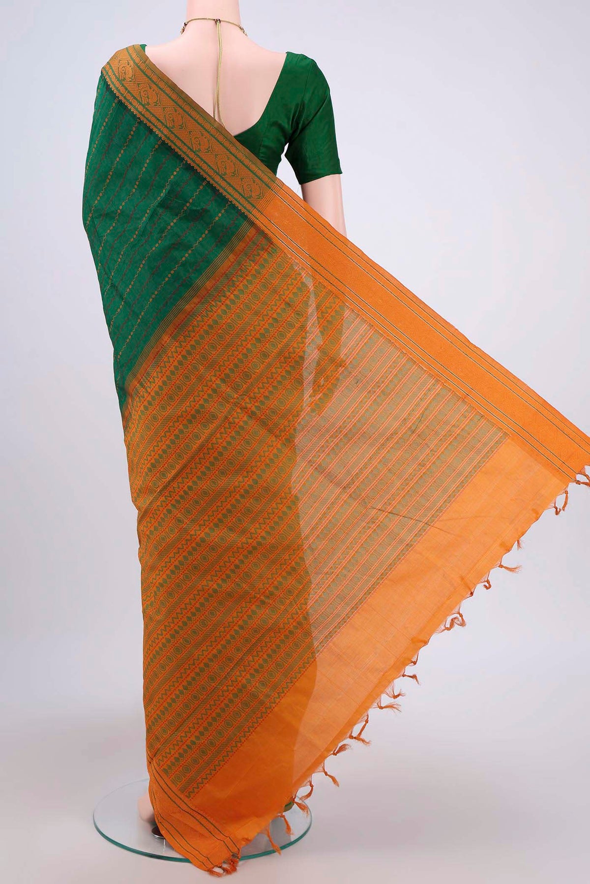 Flat view of Green Blended Silk Cotton Saree with Stripes on the body and Thread Border. 
