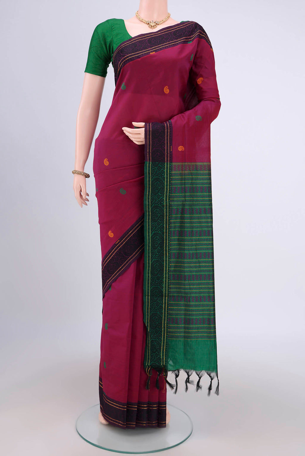 Magenta Blended Poly Cotton Saree with Thread Butta on the body and Thread Border.  displayed on a mannequin
