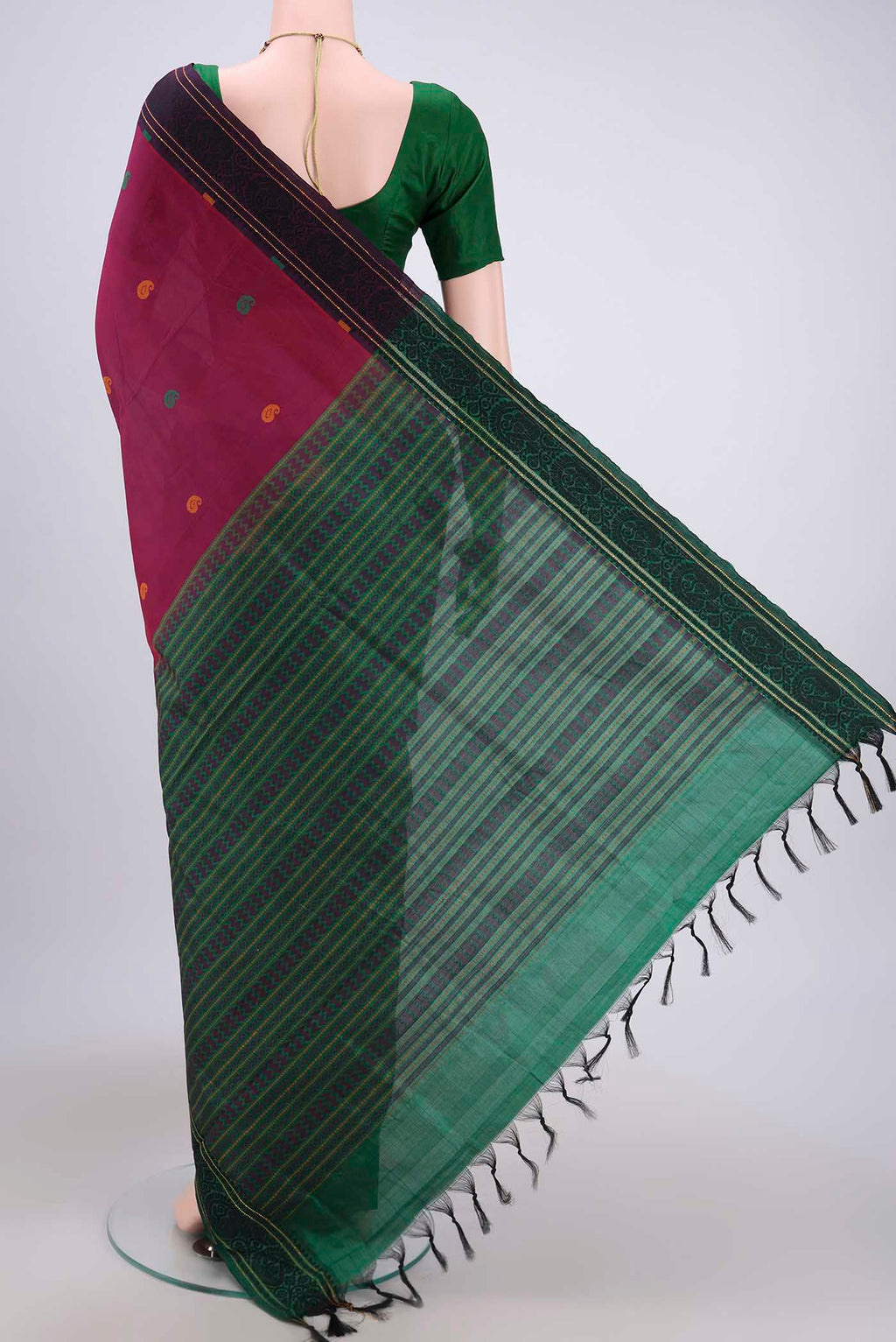 Flat view of Magenta Blended Poly Cotton Saree with Thread Butta on the body and Thread Border. 