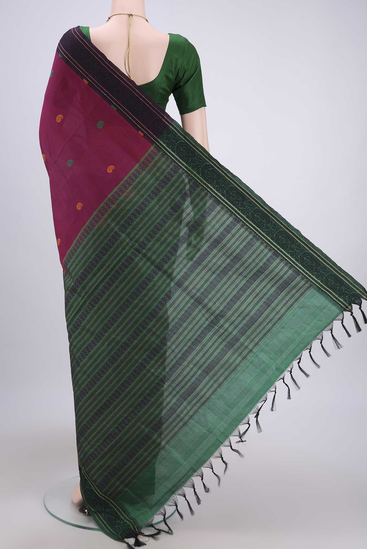 Flat view of Magenta Blended Poly Cotton Saree with Thread Butta on the body and Thread Border. 