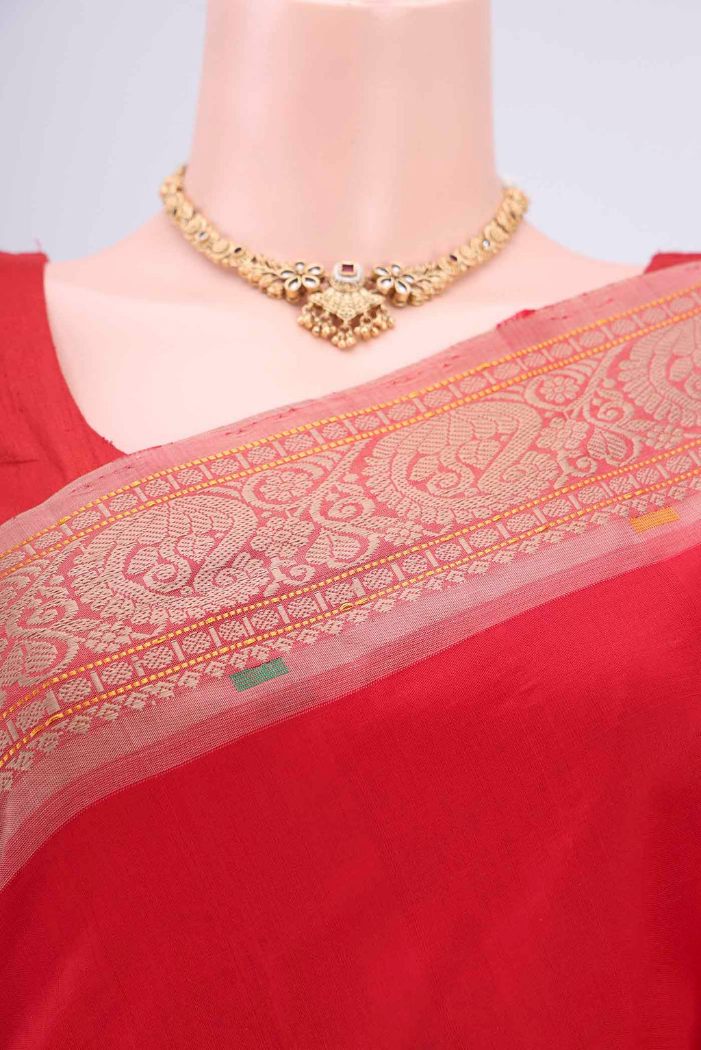 Border image of Red Blended Poly Cotton Saree with Thread Butta on the body and Thread Border. 