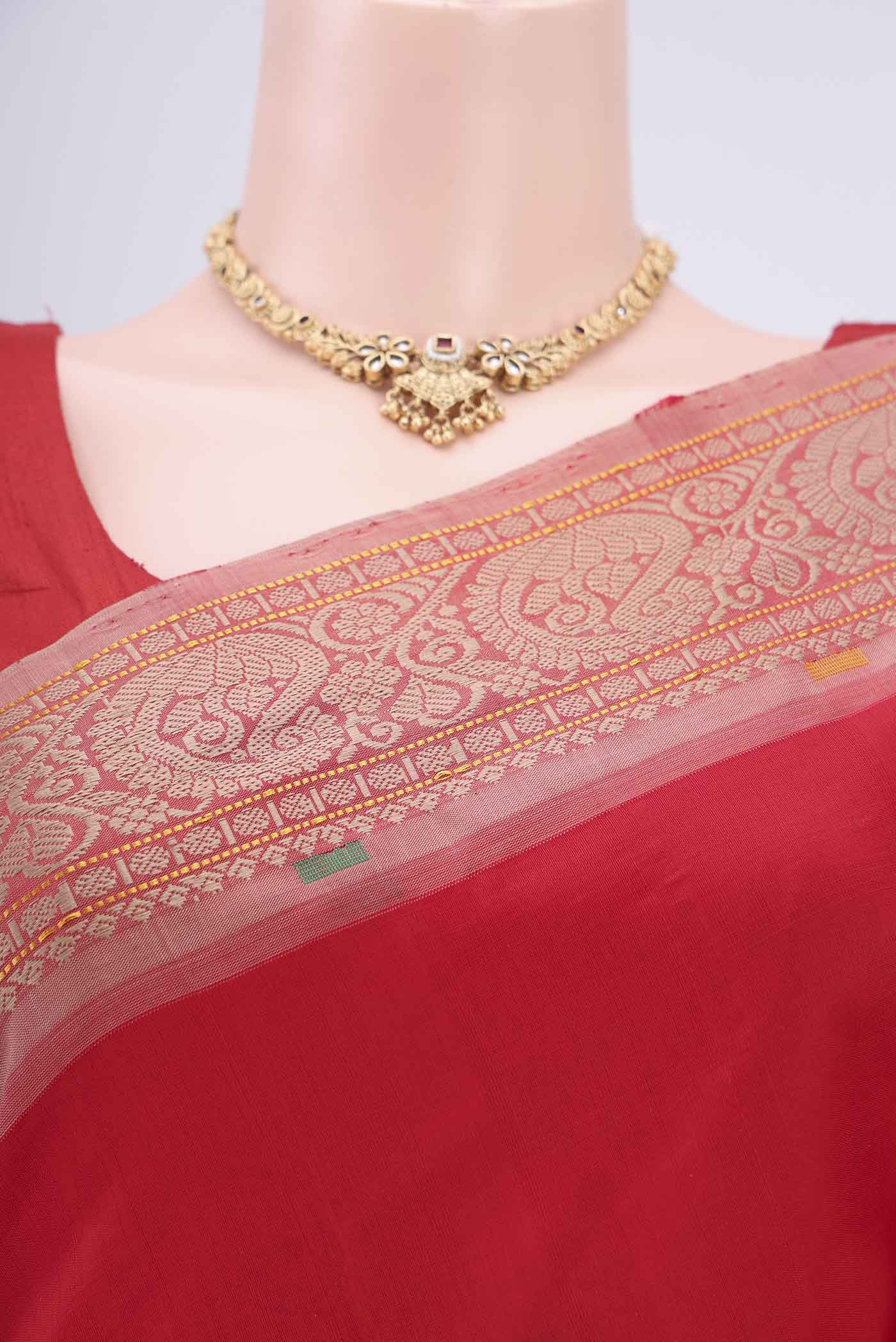 Border image of Red Blended Poly Cotton Saree with Thread Butta on the body and Thread Border. 