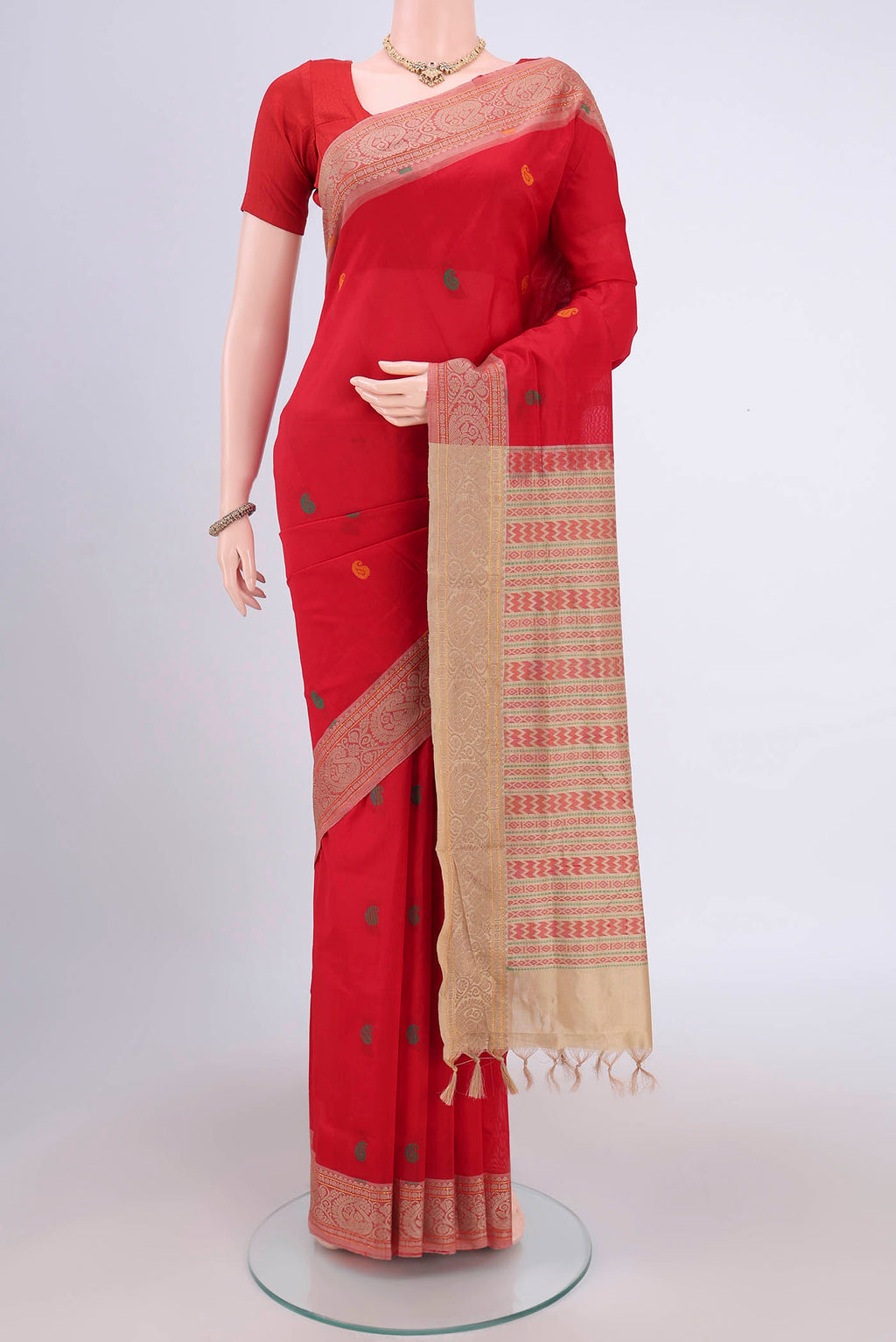 Red Blended Poly Cotton Saree with Thread Butta on the body and Thread Border.  displayed on a mannequin