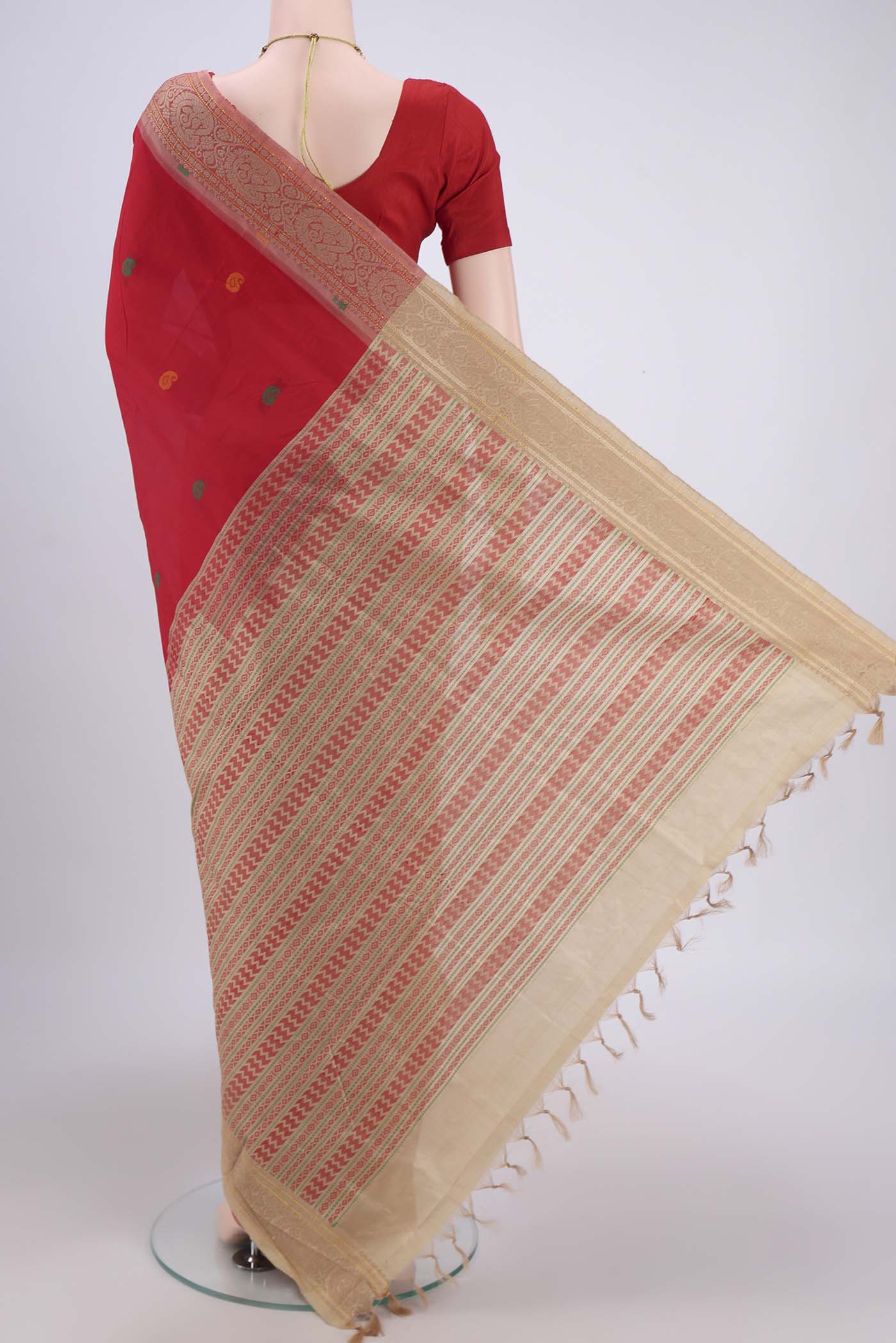 Flat view of Red Blended Poly Cotton Saree with Thread Butta on the body and Thread Border. 
