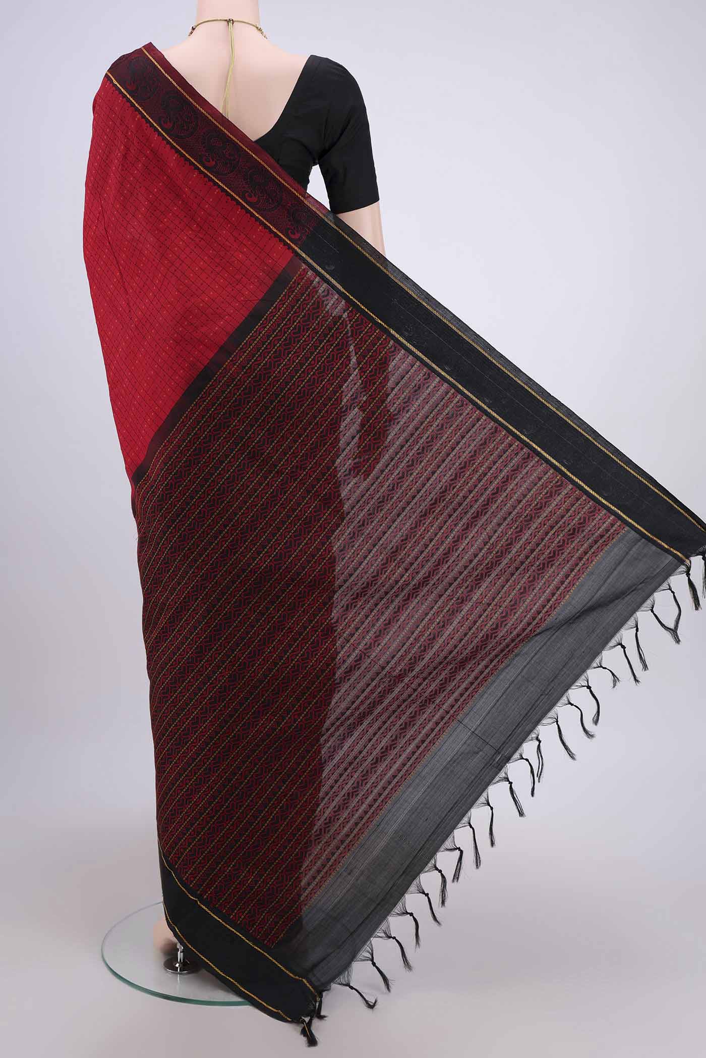 Flat view of Red Blended Silk Cotton Saree with Checked design on the body and Thread Border. 