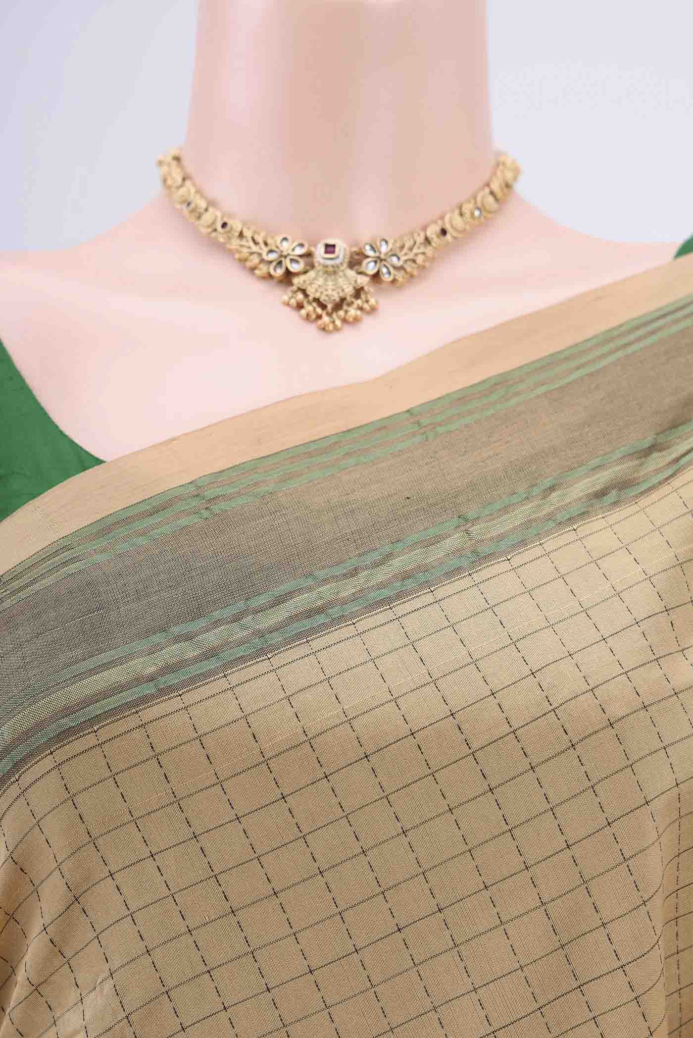 Border image of Beige Blended Silk Cotton Saree with Checked design on the body and Thread Border. 