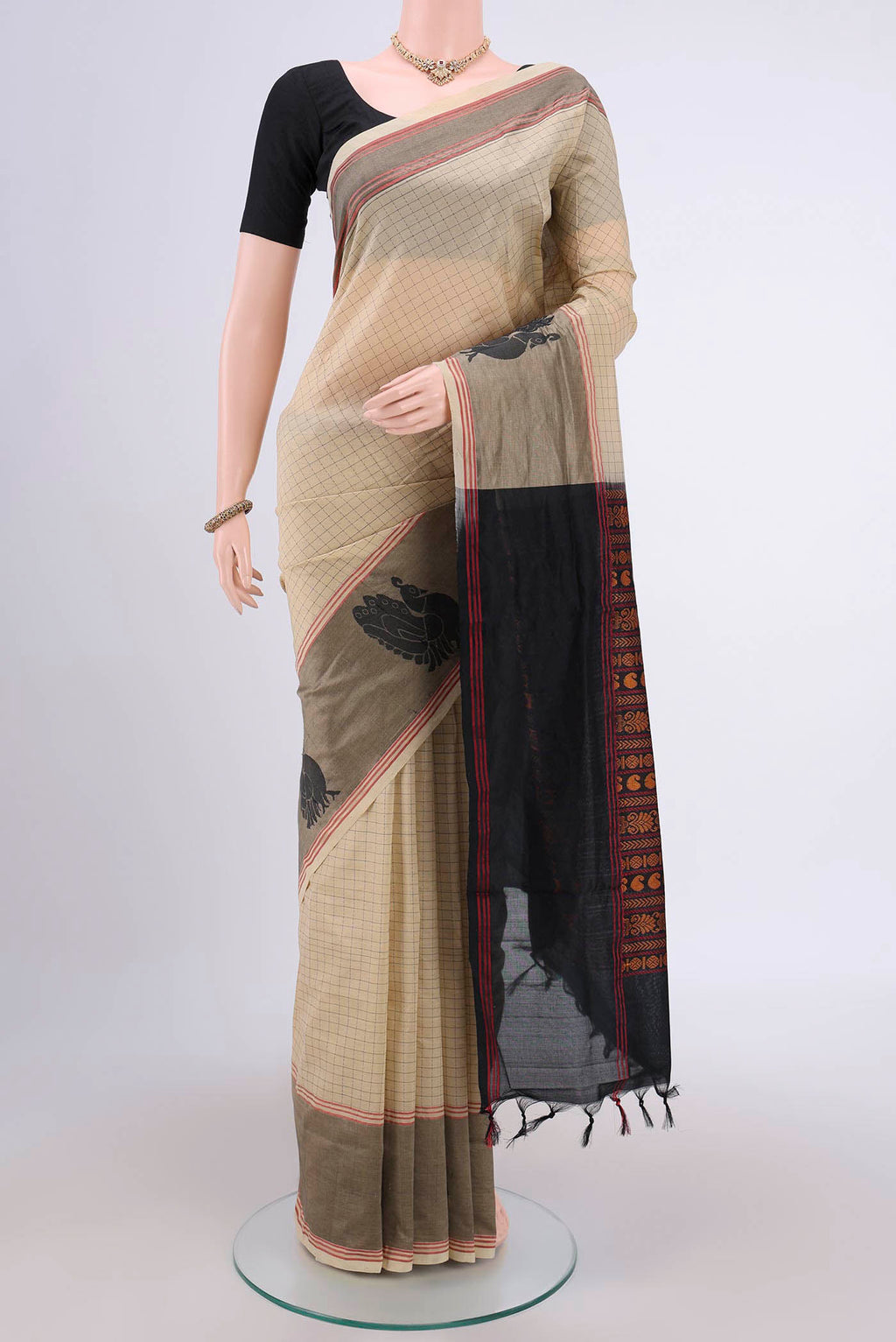Beige Blended Silk Cotton Saree with Checked design on the body and Thread Border.  displayed on a mannequin
