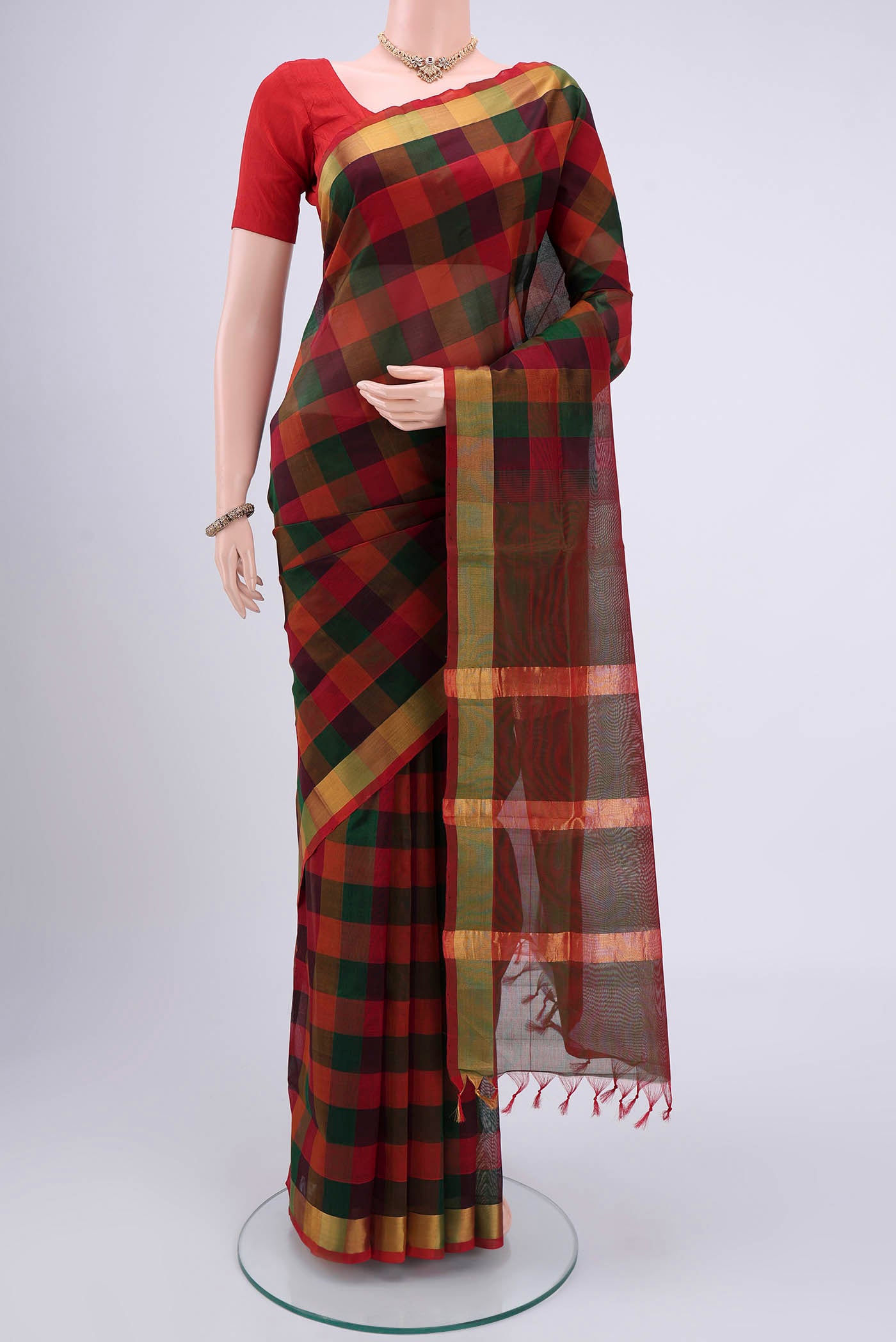 Multi Color Blended Coimbatore Silk Cotton Saree with Checked design on the body and Zari Border.  displayed on a mannequin