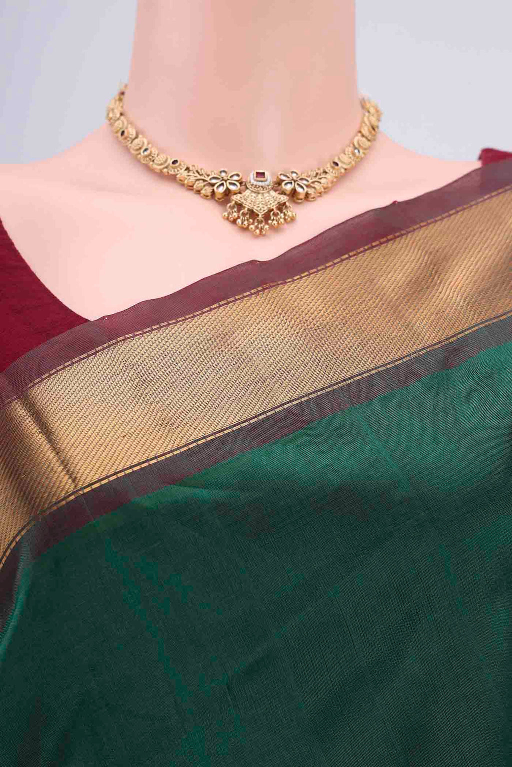Border image of Bottle Green Blended Coimbatore Silk Cotton Saree with Plain Body and Zari Border. 