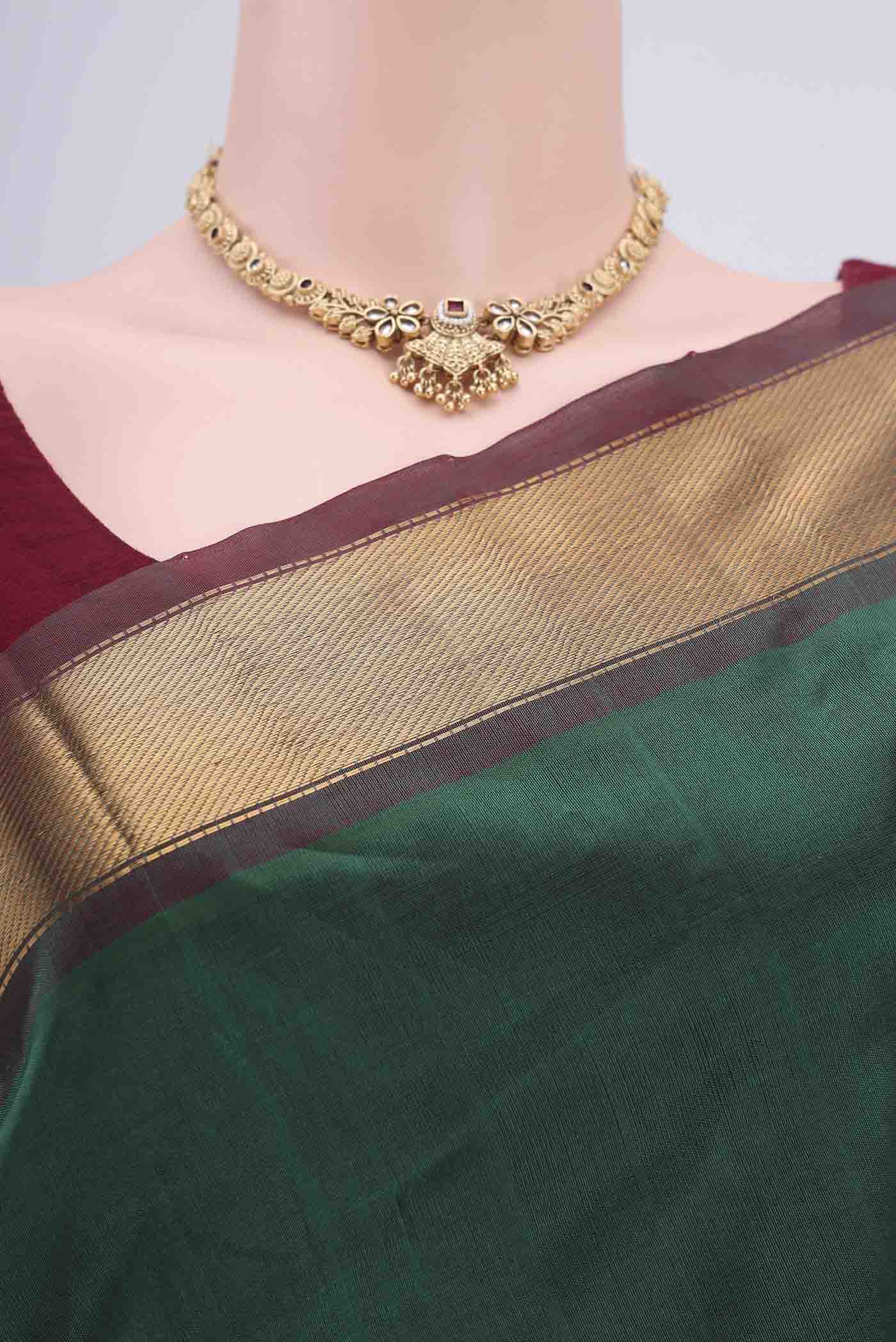 Border image of Bottle Green Blended Coimbatore Silk Cotton Saree with Plain Body and Zari Border. 