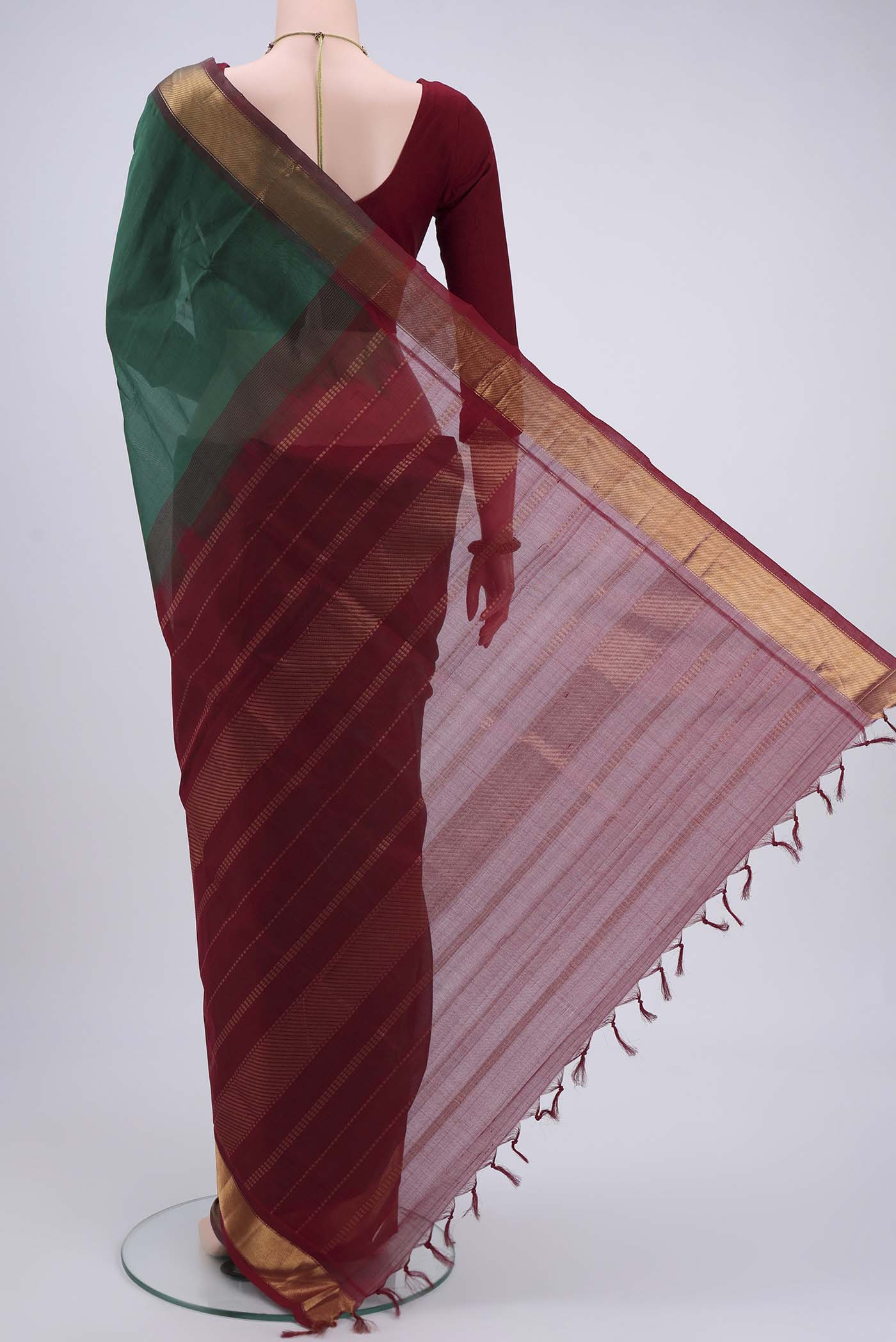 Flat view of Bottle Green Blended Coimbatore Silk Cotton Saree with Plain Body and Zari Border. 