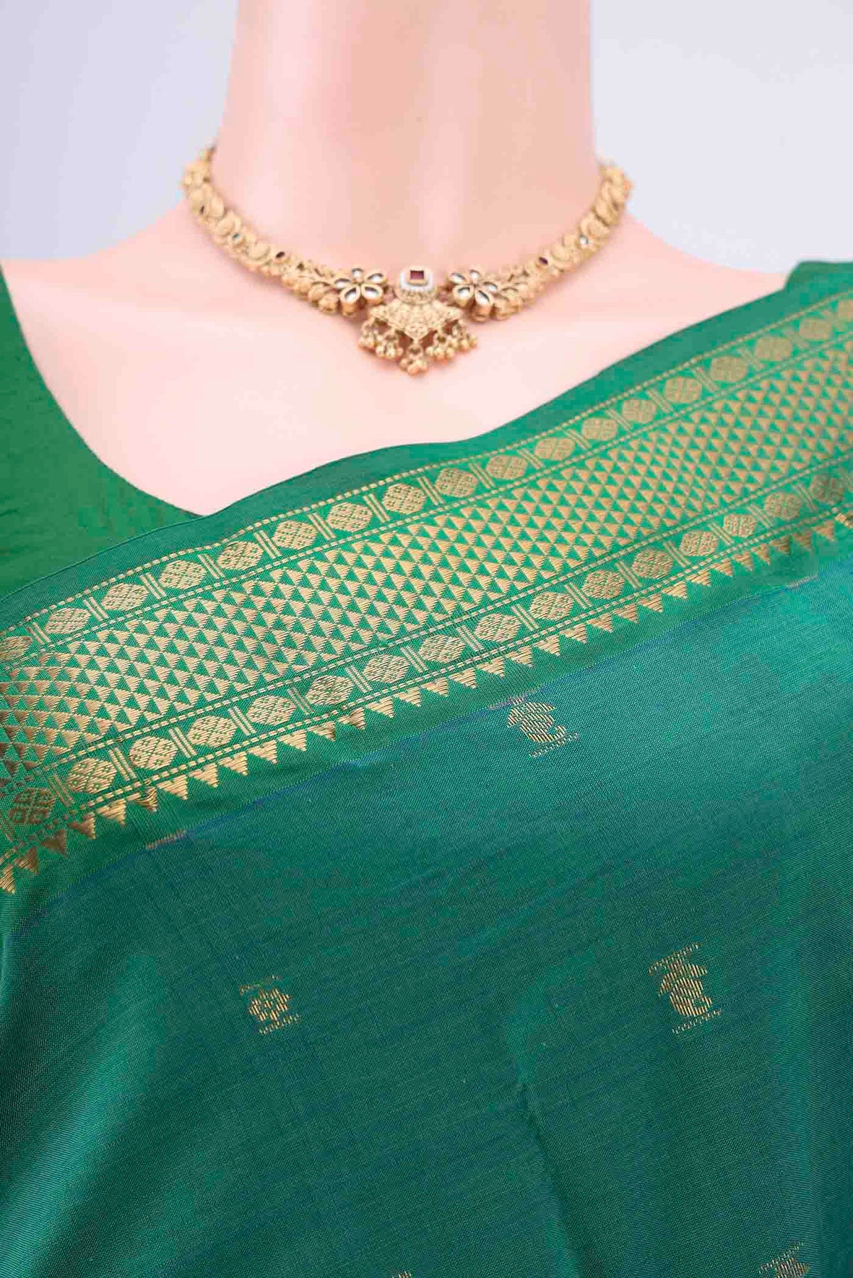 Border image of Sea Green Blended Poly Cotton Saree with Zari Butta on the body and Zari Border. 