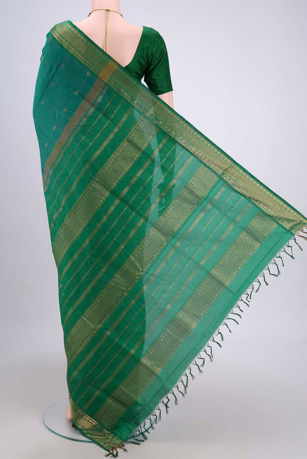 Flat view of Sea Green Blended Poly Cotton Saree with Zari Butta on the body and Zari Border. 