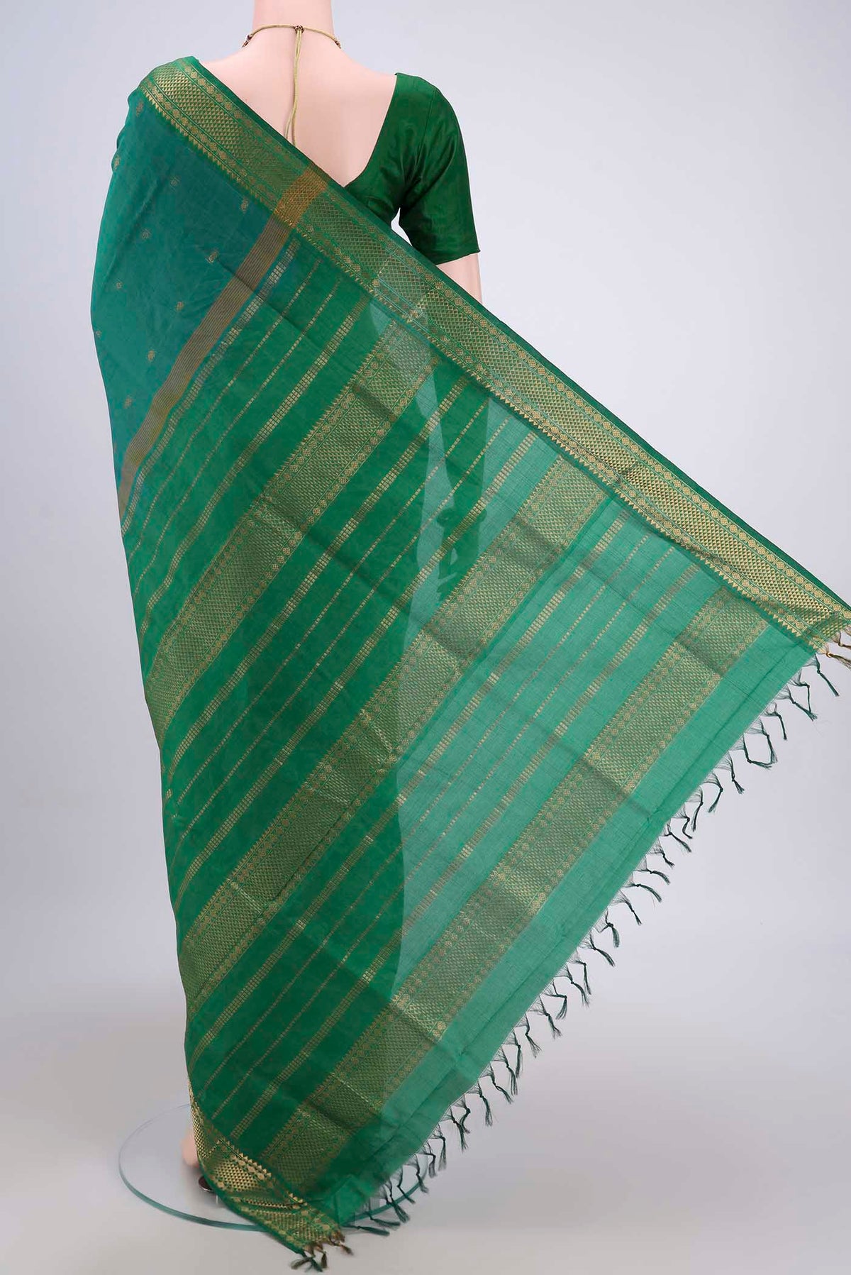 Flat view of Sea Green Blended Poly Cotton Saree with Zari Butta on the body and Zari Border. 