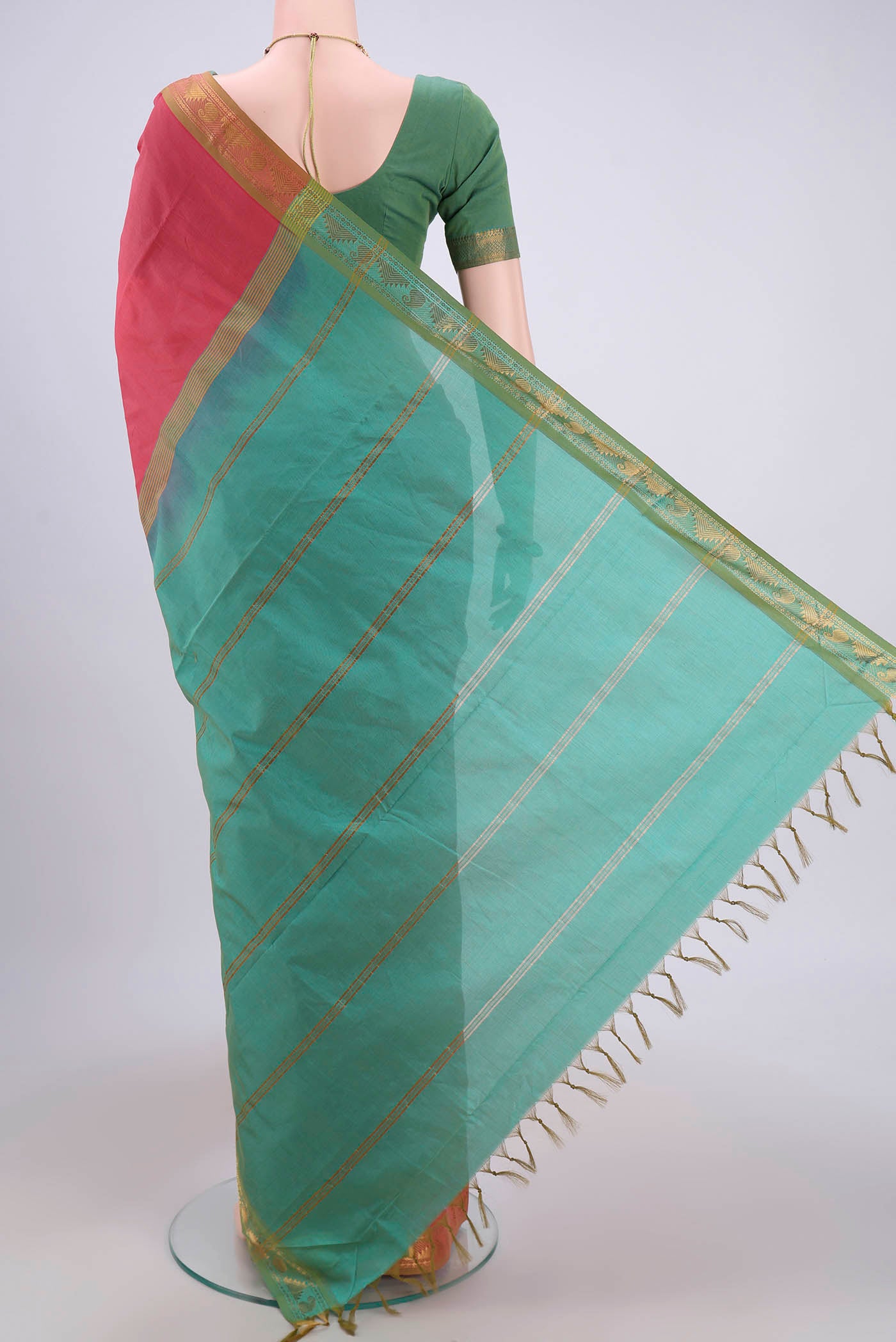 Flat view of Peach Blended Poly Cotton Saree with Plain Body and Zari Border. 