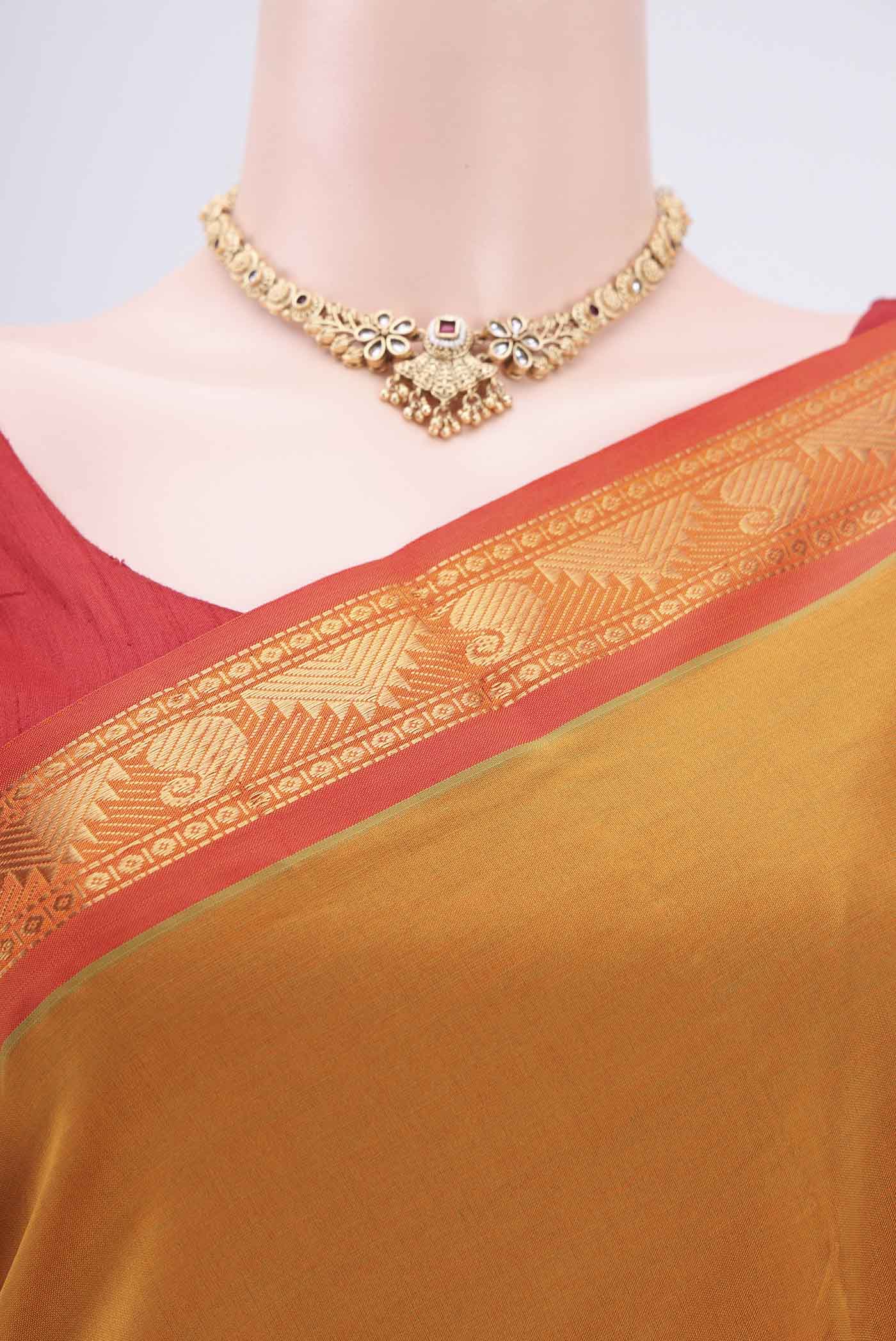 Border image of Mustard Blended Poly Cotton Saree with Plain Body and Zari Border. 