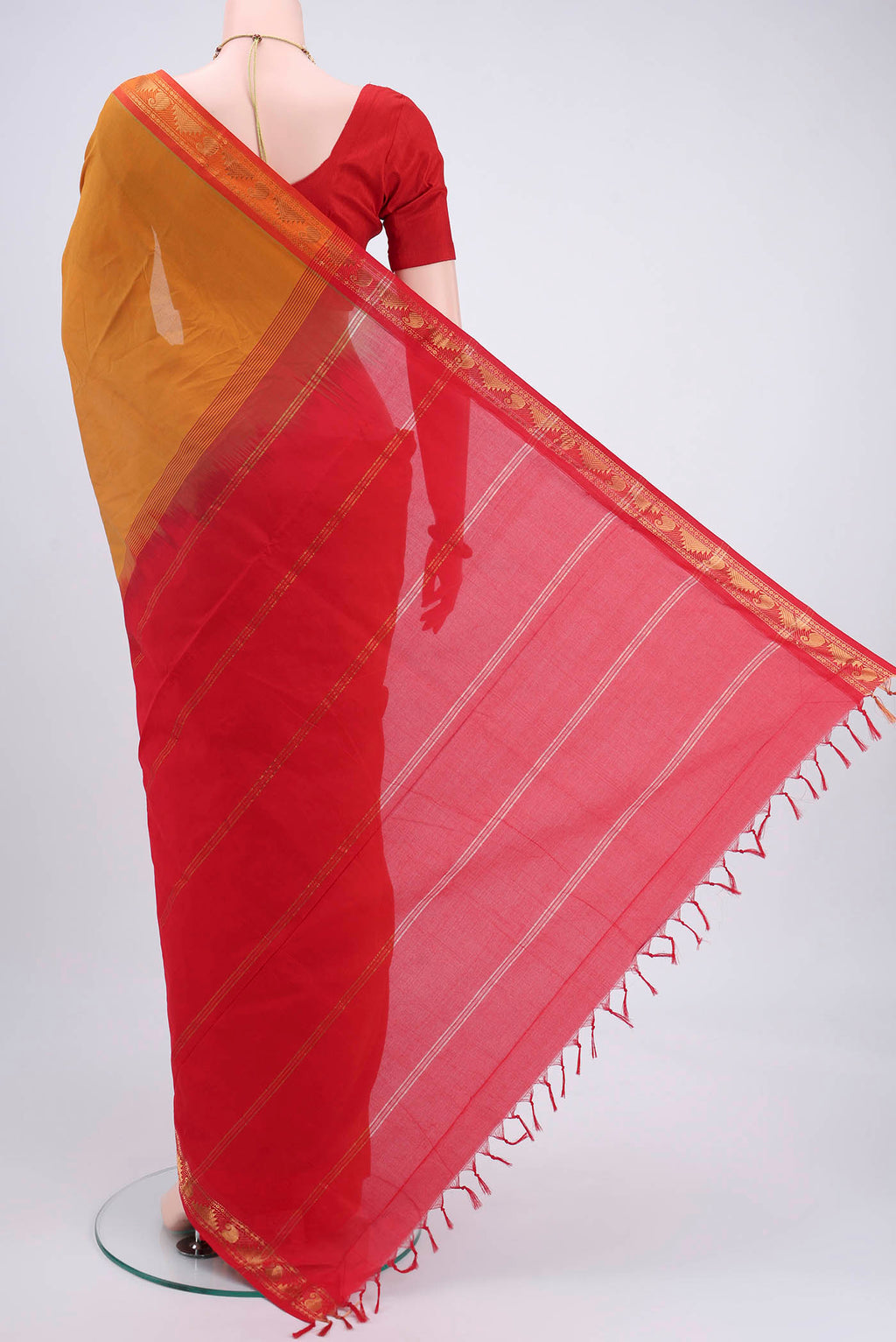 Flat view of Mustard Blended Poly Cotton Saree with Plain Body and Zari Border. 