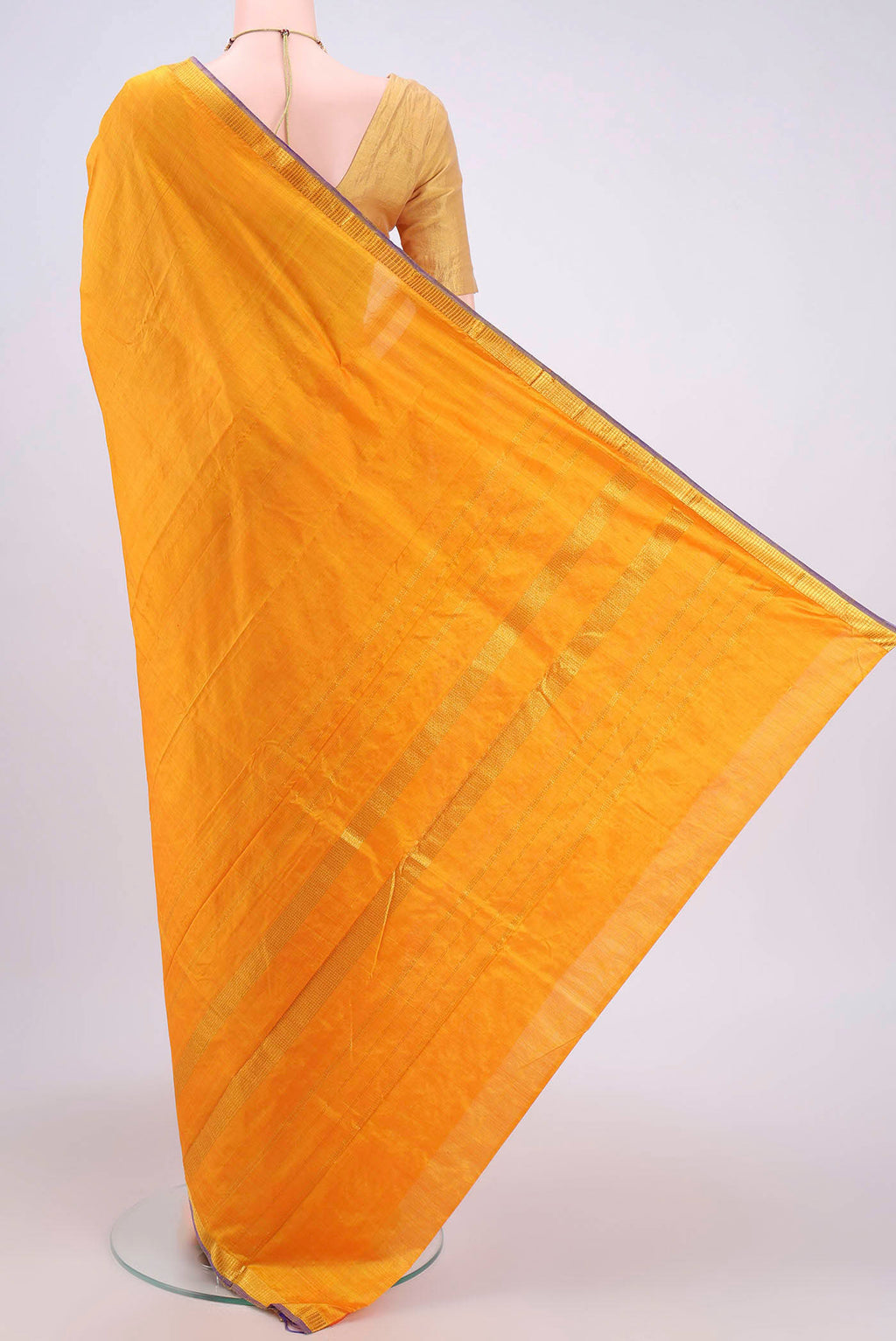 Flat view of Yellow Kanchipuram Silk Saree with Plain Body and Zari Border. 