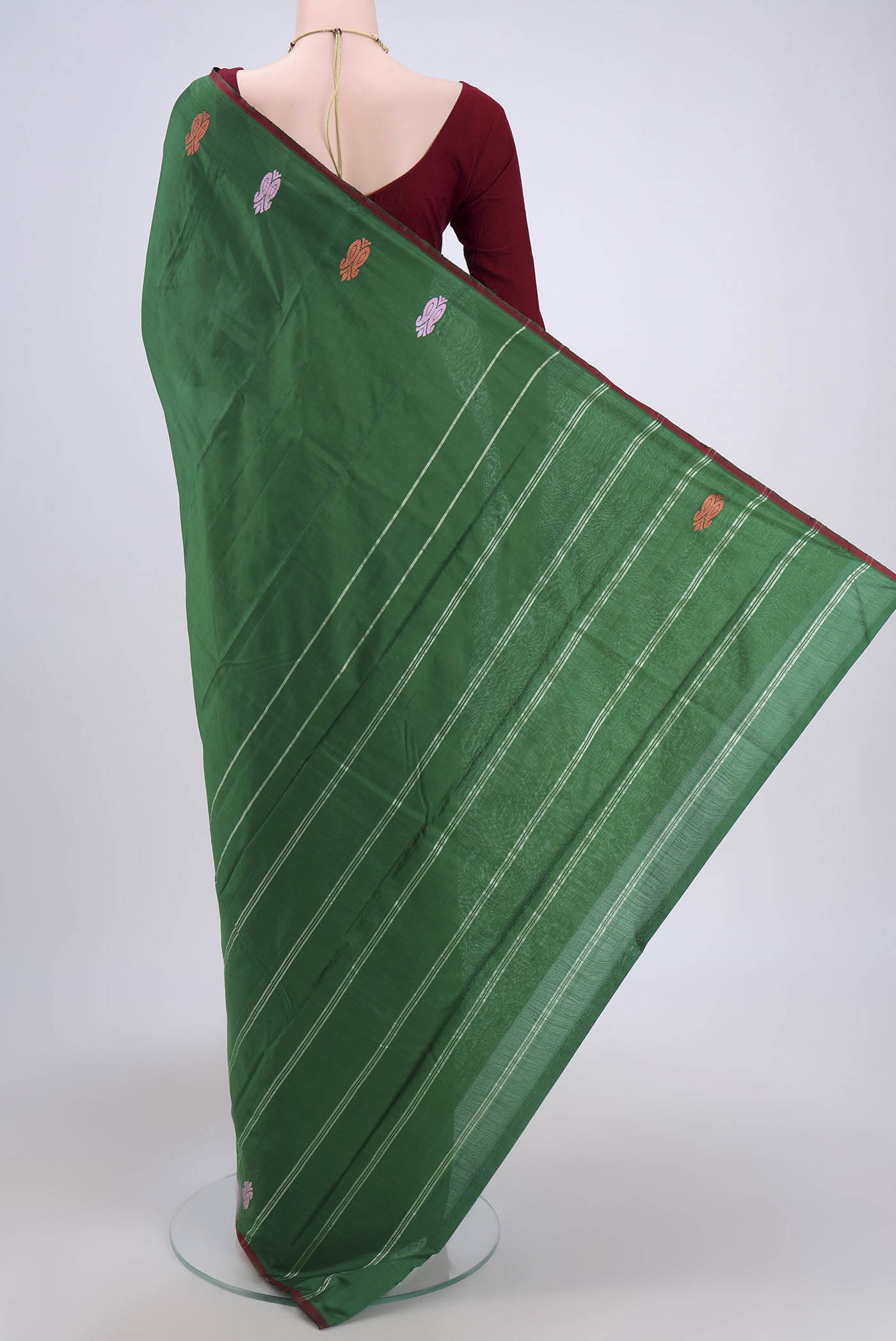 Flat view of Bottle Green Kanchipuram Saree with Plain Body and Thread Border. 