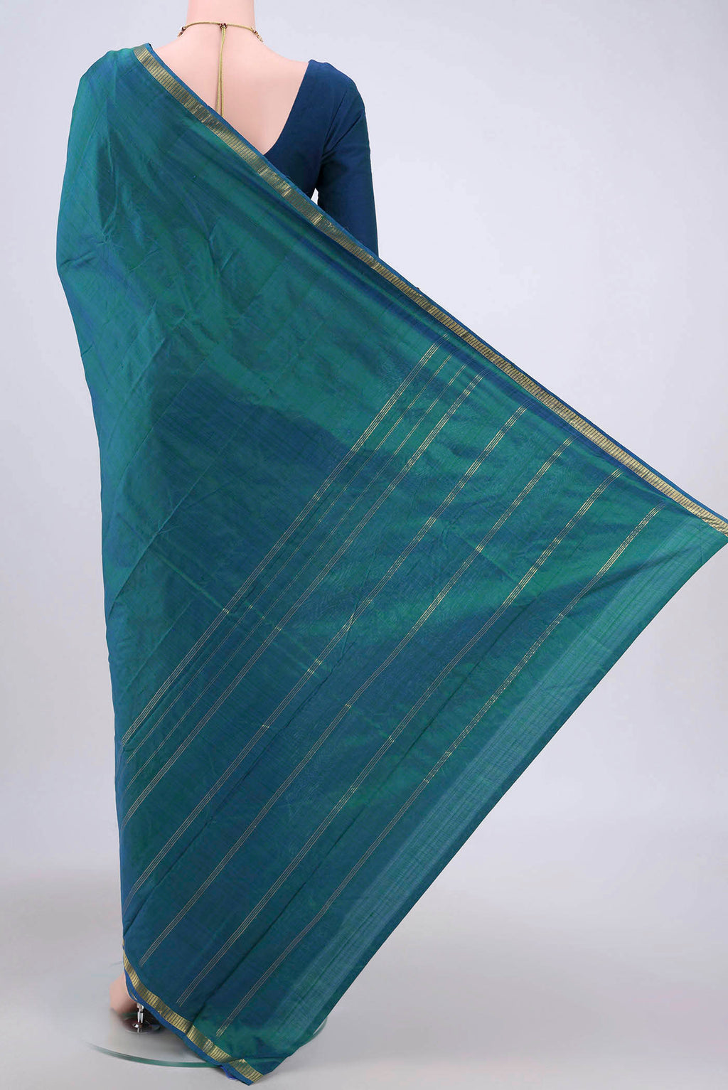 Flat view of Sea Green Kanchipuram Silk Saree with Plain Body and Zari Border. 