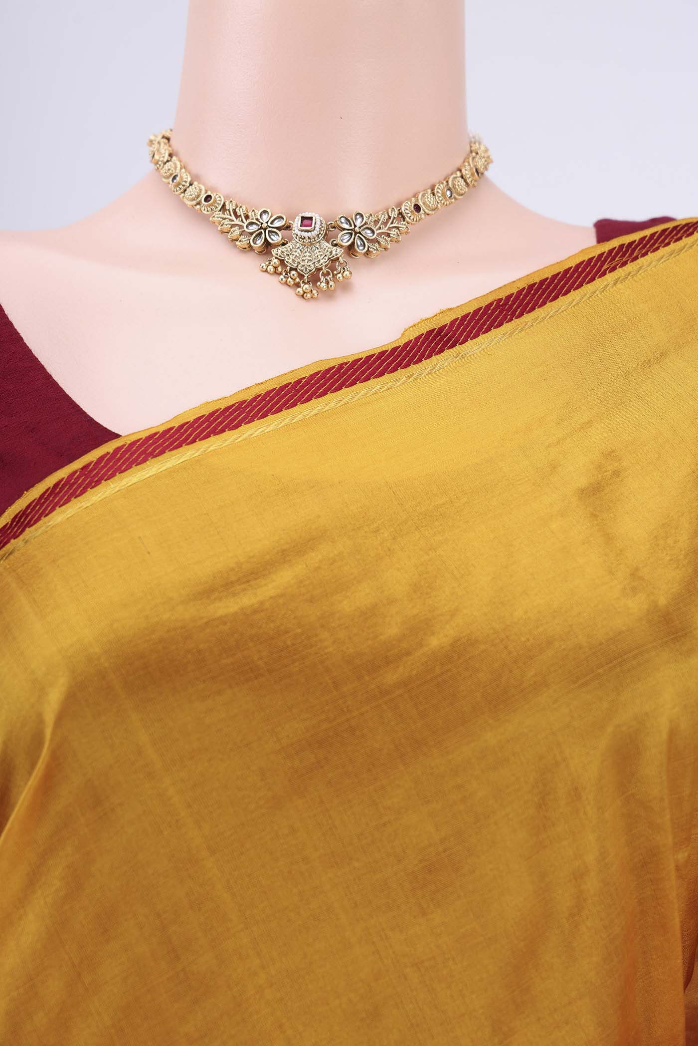 Border image of Mustard Kanchipuram Saree with Plain Body and Zari And Thread Border. 