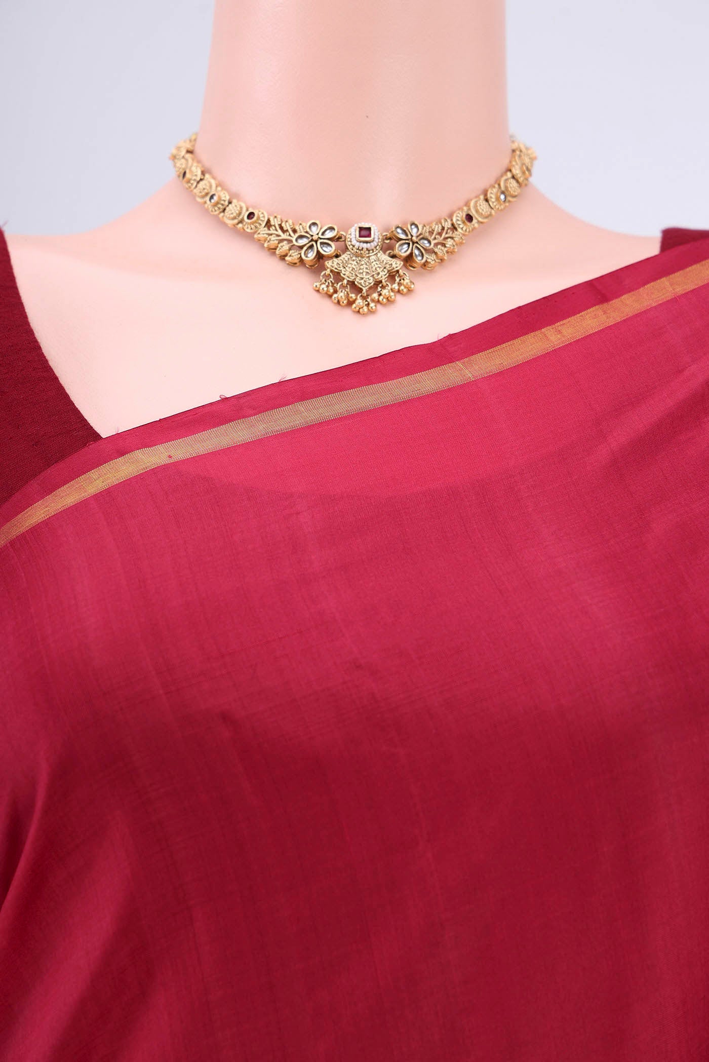 Border image of Maroon Kanchipuram Silk Saree with Plain Body and Zari Border. 