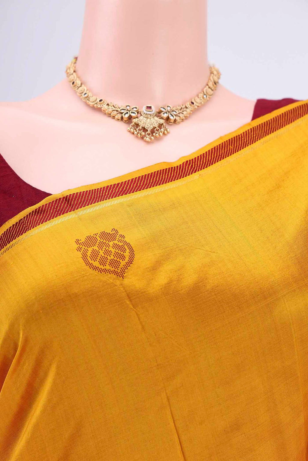 Border image of Mustard Kanchipuram Saree with Plain Body and Zari And Thread Border. 
