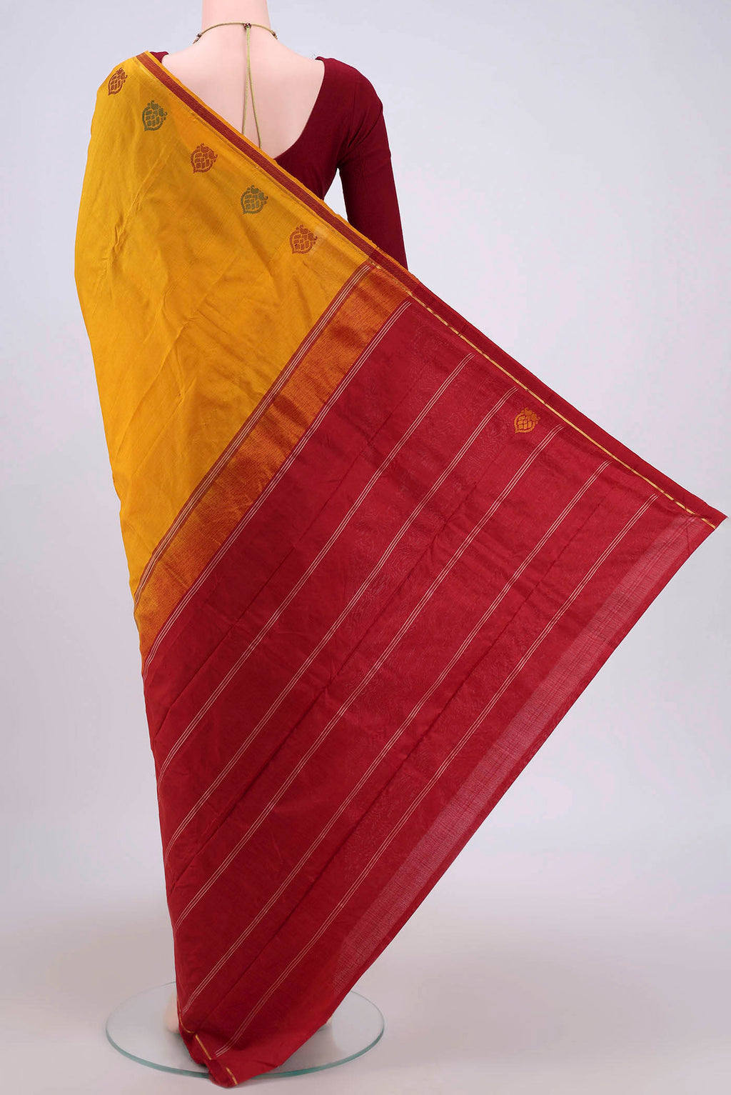 Flat view of Mustard Kanchipuram Saree with Plain Body and Zari And Thread Border. 
