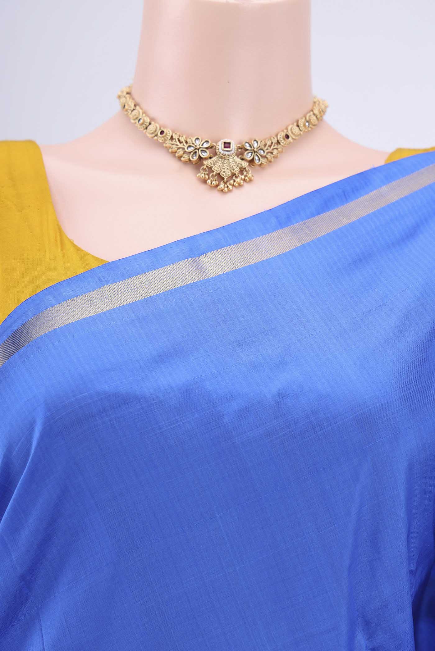 Border image of Blue Kanchipuram Saree with Plain Body and Zari And Thread Border. 