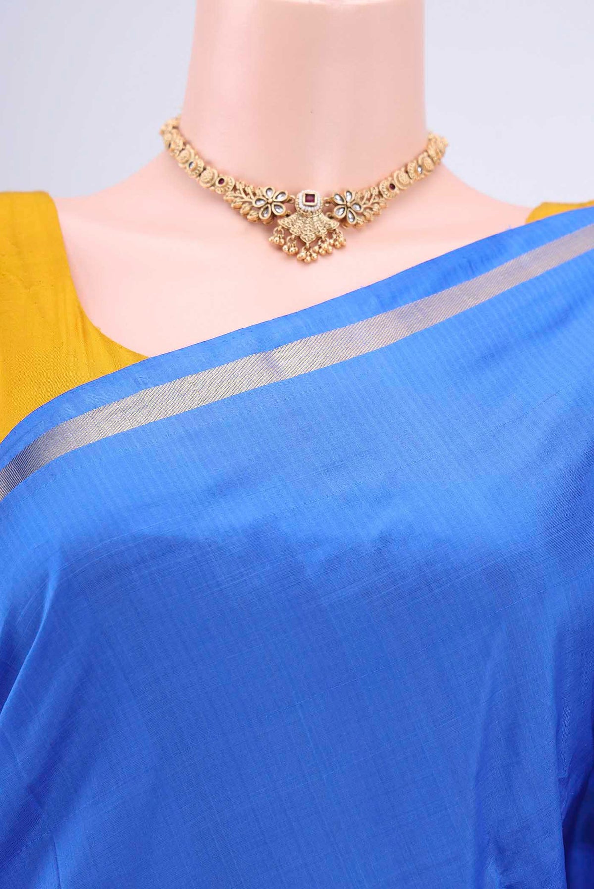 Border image of Blue Kanchipuram Saree with Plain Body and Zari And Thread Border. 