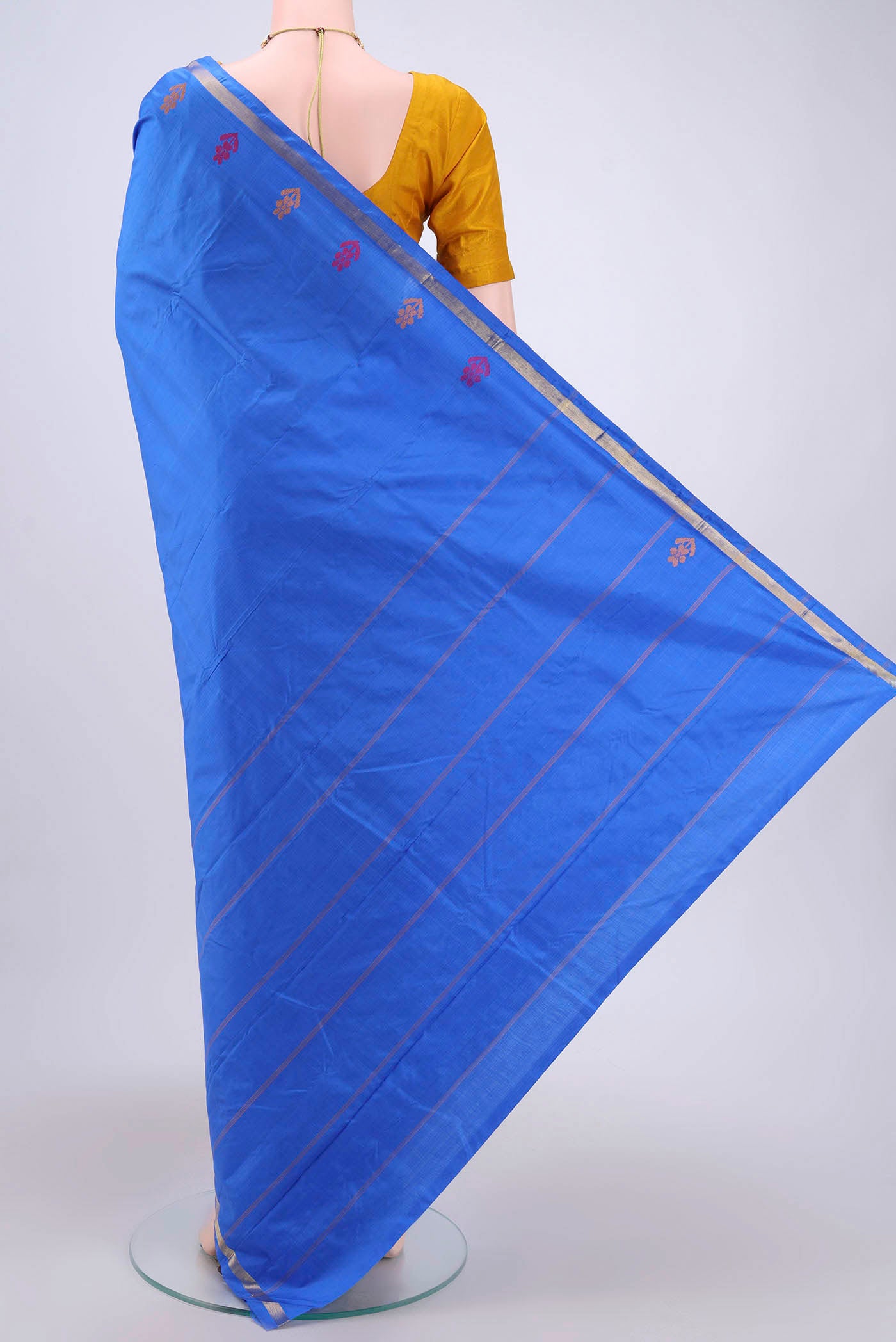 Flat view of Blue Kanchipuram Saree with Plain Body and Zari And Thread Border. 