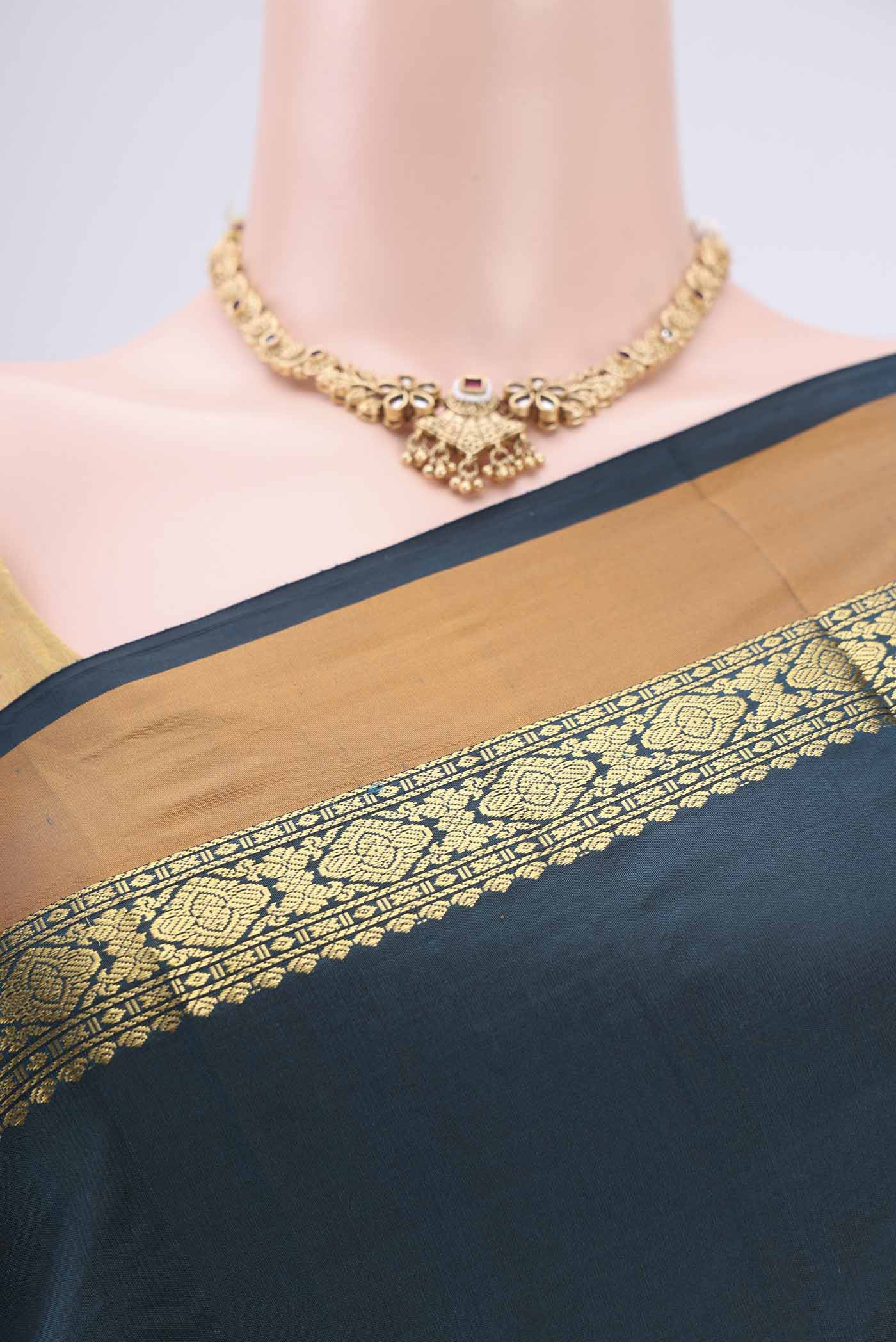 Border image of Bottle Green Blended Bangalore Silk Saree with Zari Butta on the body and Zari Border. 