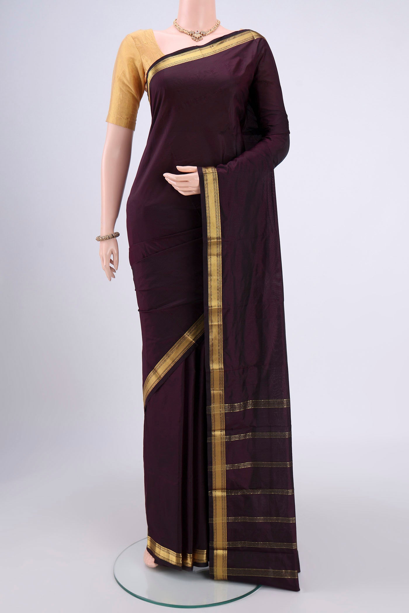 Coffee Brown Blended Bangalore Silk Saree with Zari Butta on the body and Zari Border.  displayed on a mannequin