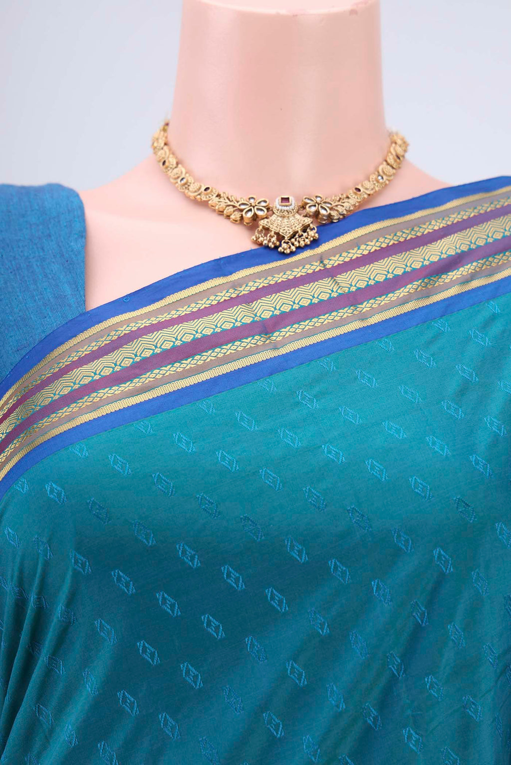 Border image of Turquoise Blended Bangalore Silk Saree with Zari Butta on the body and Zari Border. 