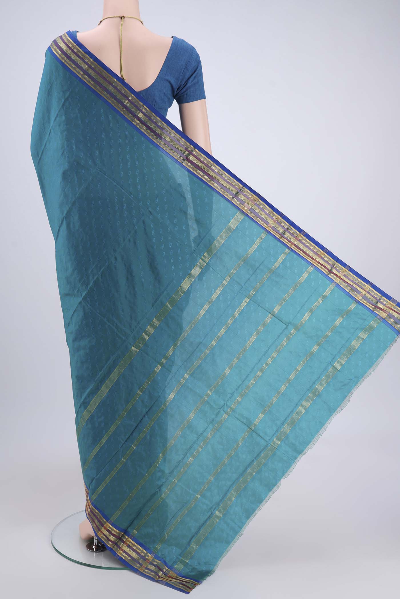 Flat view of Turquoise Blended Bangalore Silk Saree with Zari Butta on the body and Zari Border. 