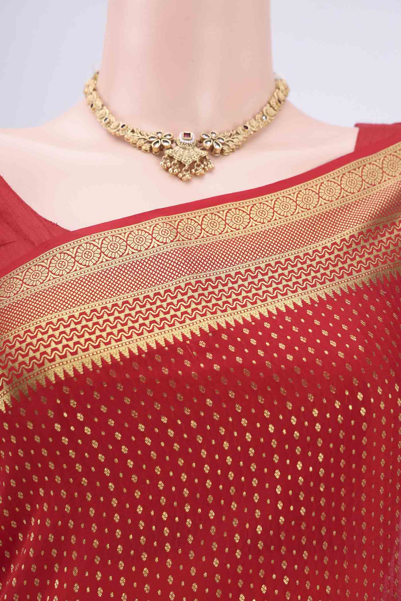 Border image of Red Mysore Crepe Saree with Zari Butta on the body and Zari Border. 